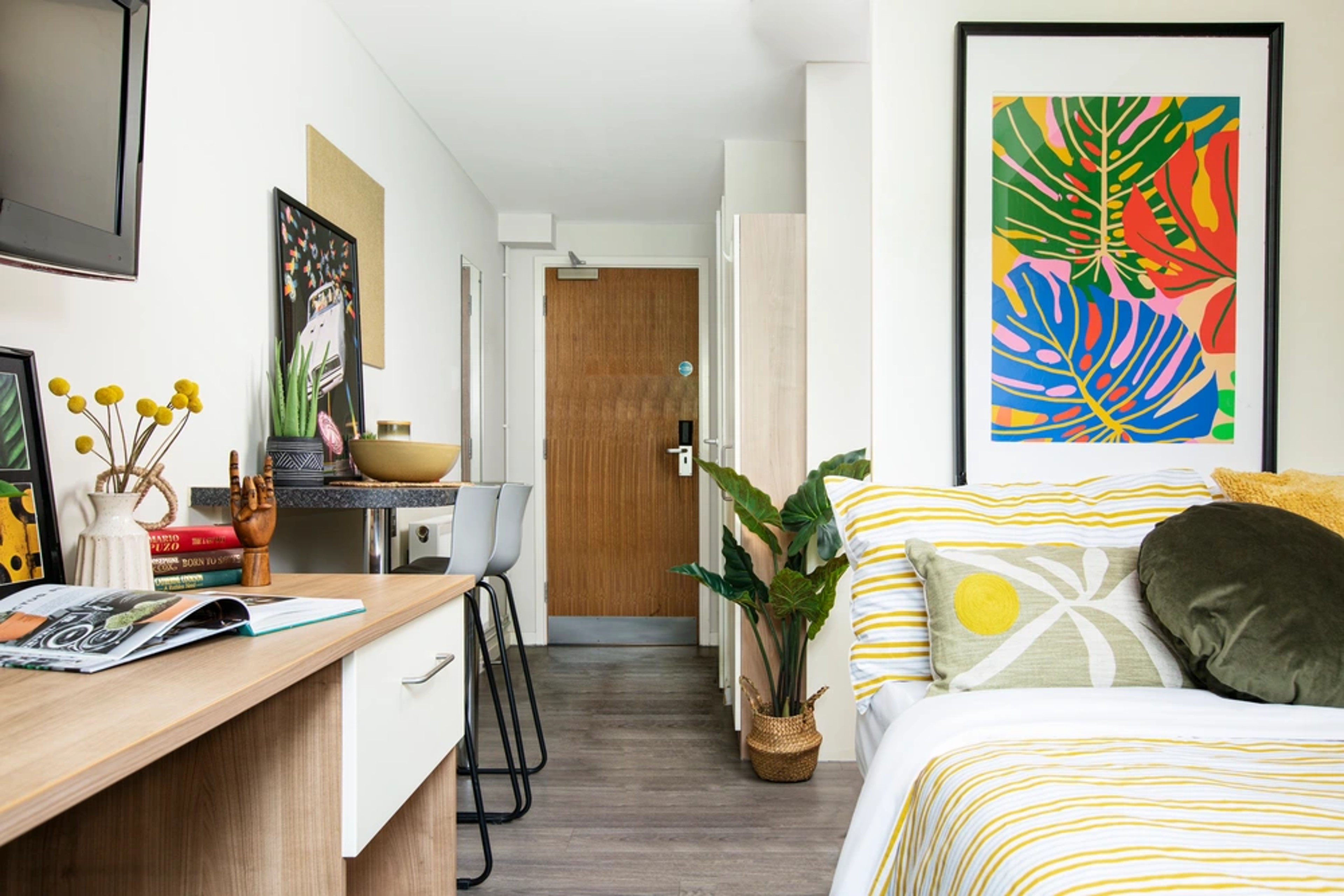 Bed and study space in a Studio room