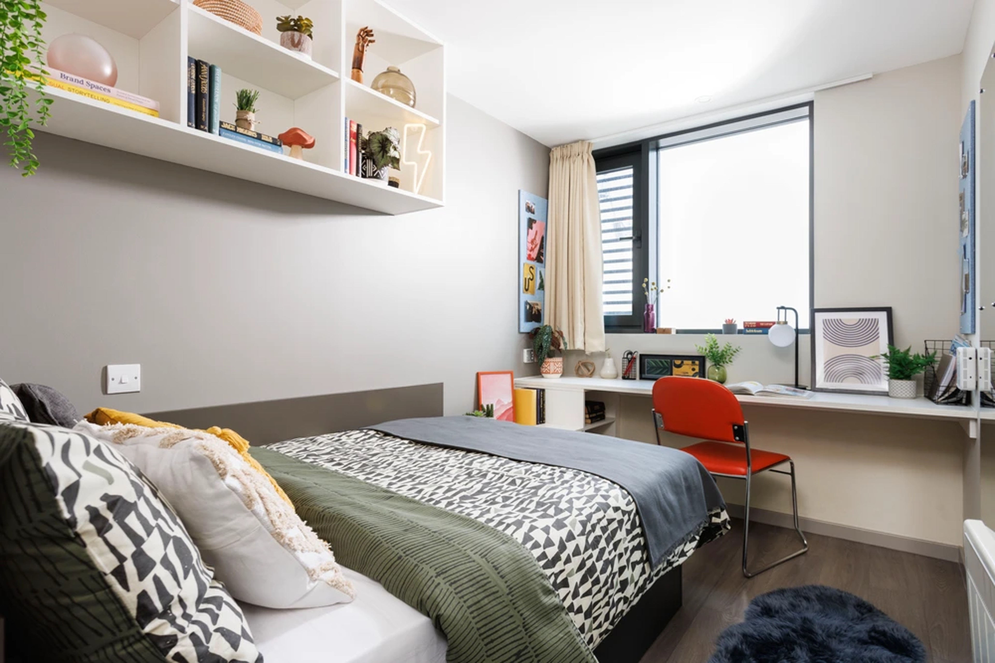 Bed and desk in an en-suite room