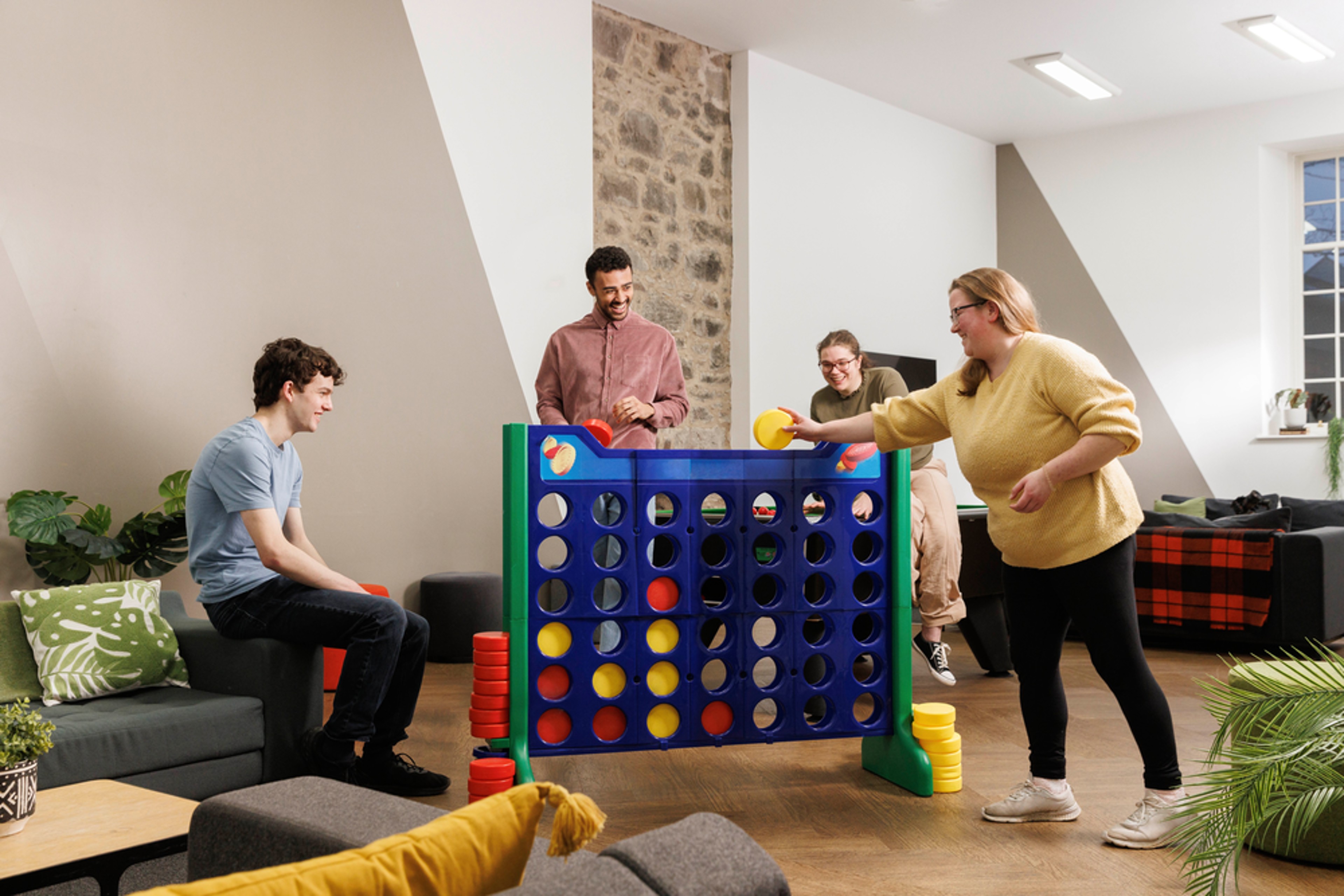 Students playing in the games area