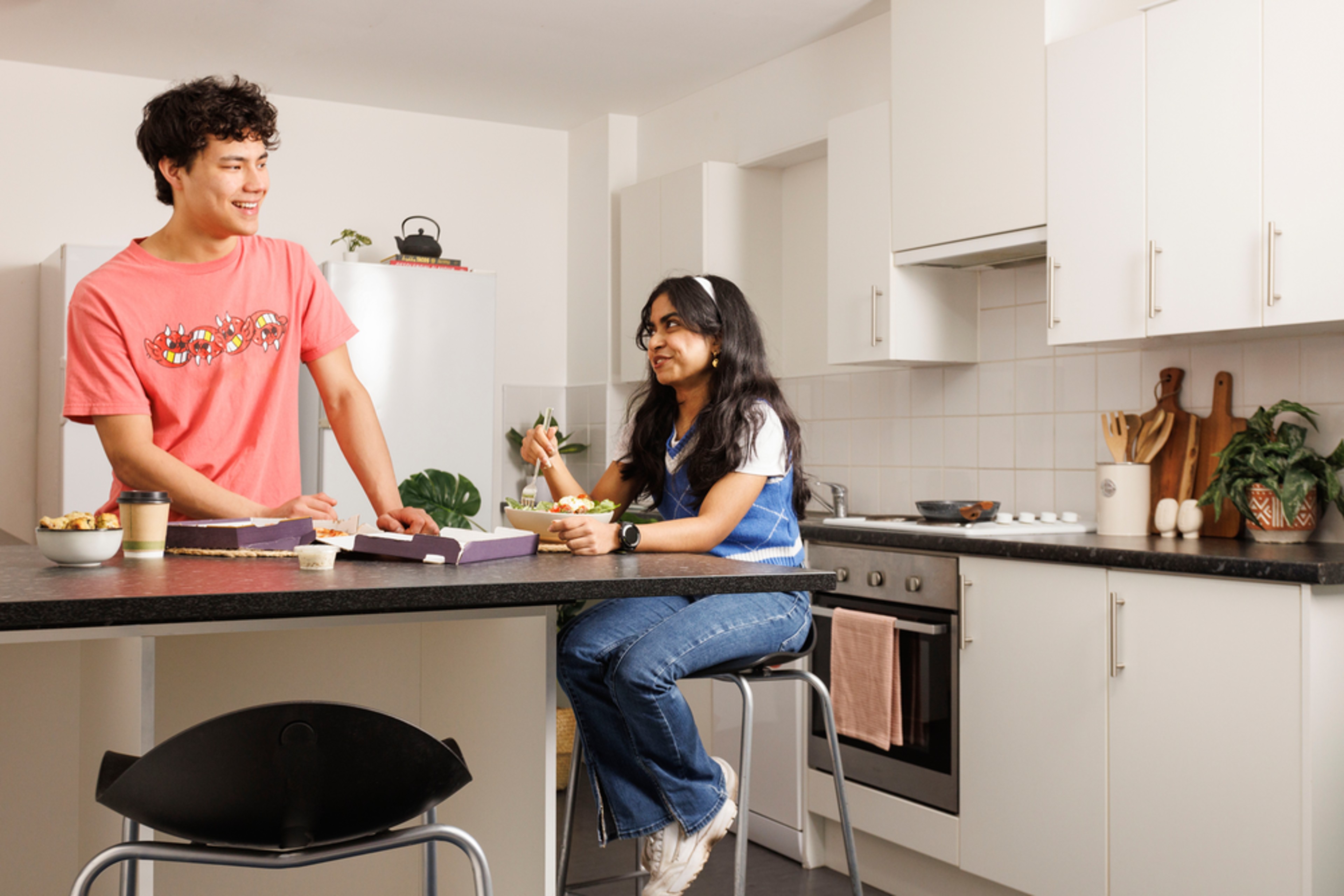 Students in a shared kitchen