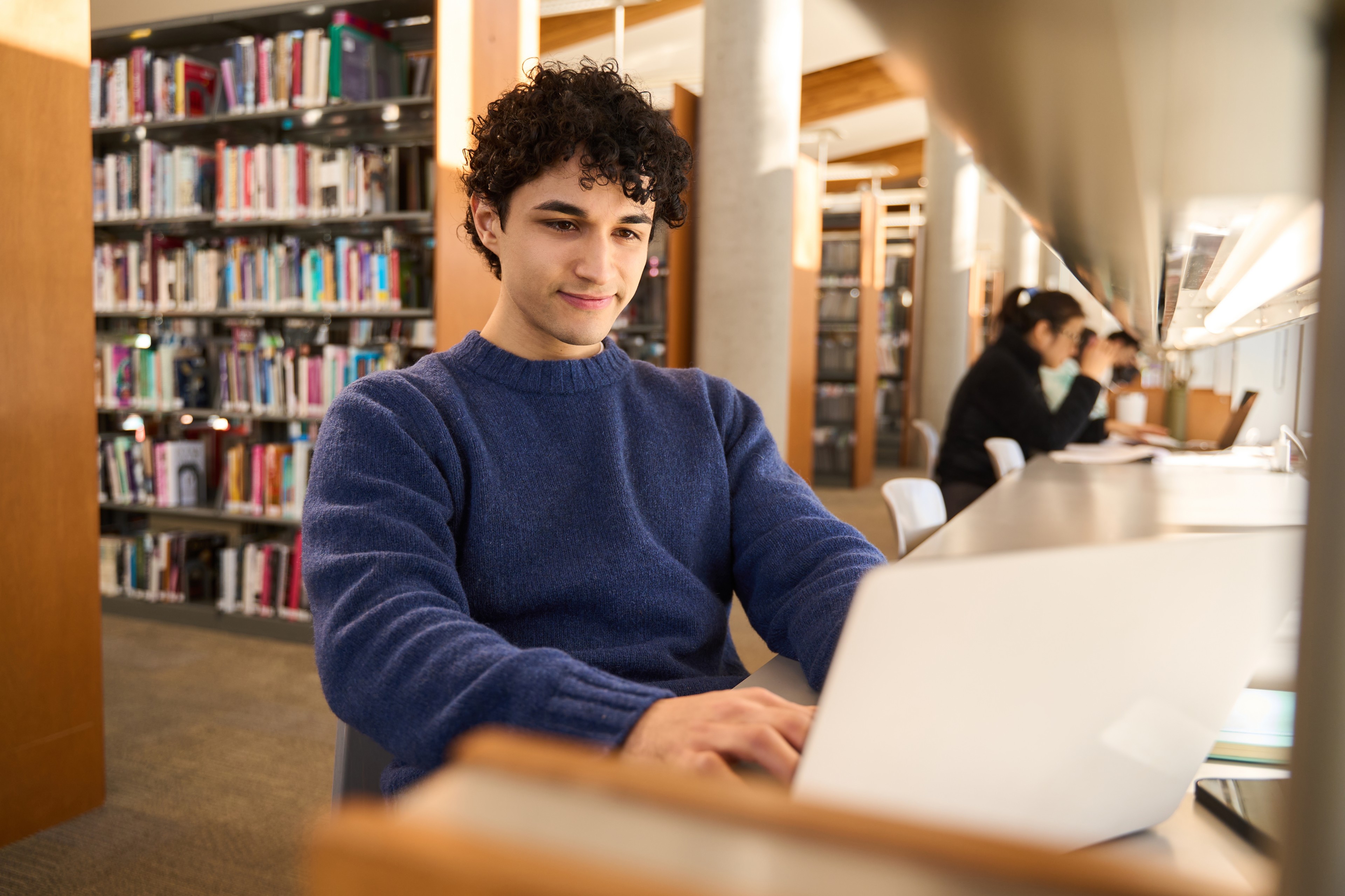 Student on laptop in the library