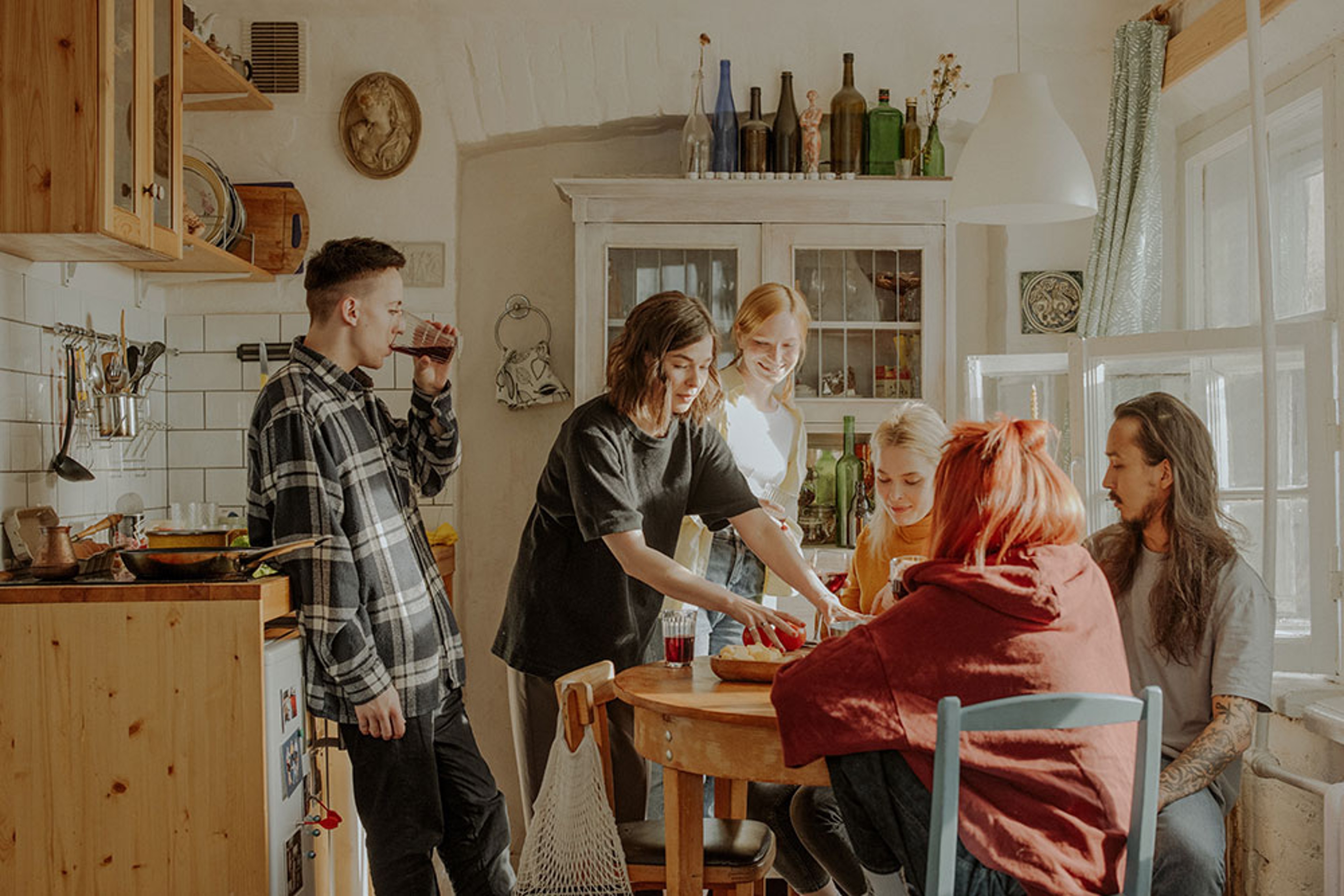 Young people sat around a kitchen table