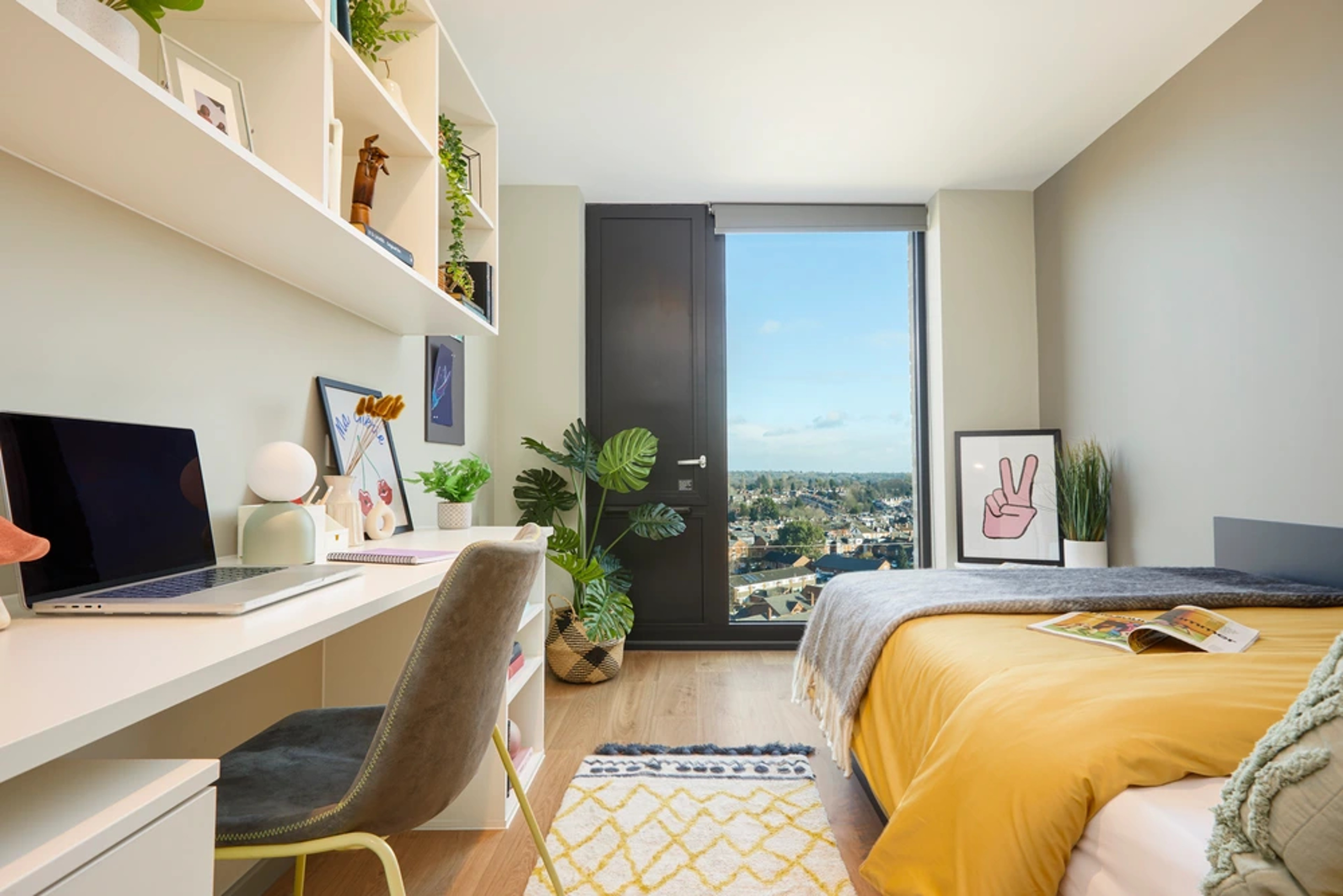 Bed and study space in an En-suite room