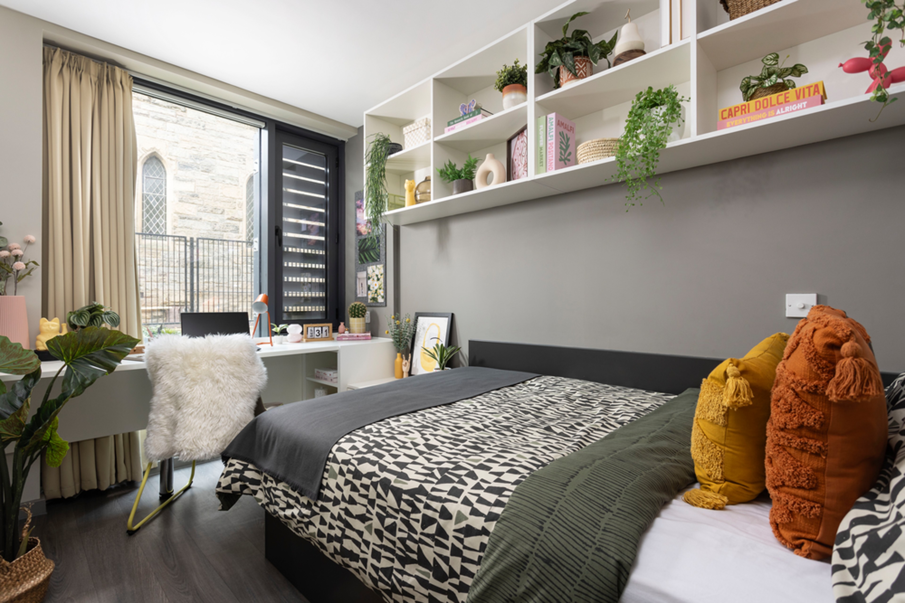 Bed and study space in an En-suite room