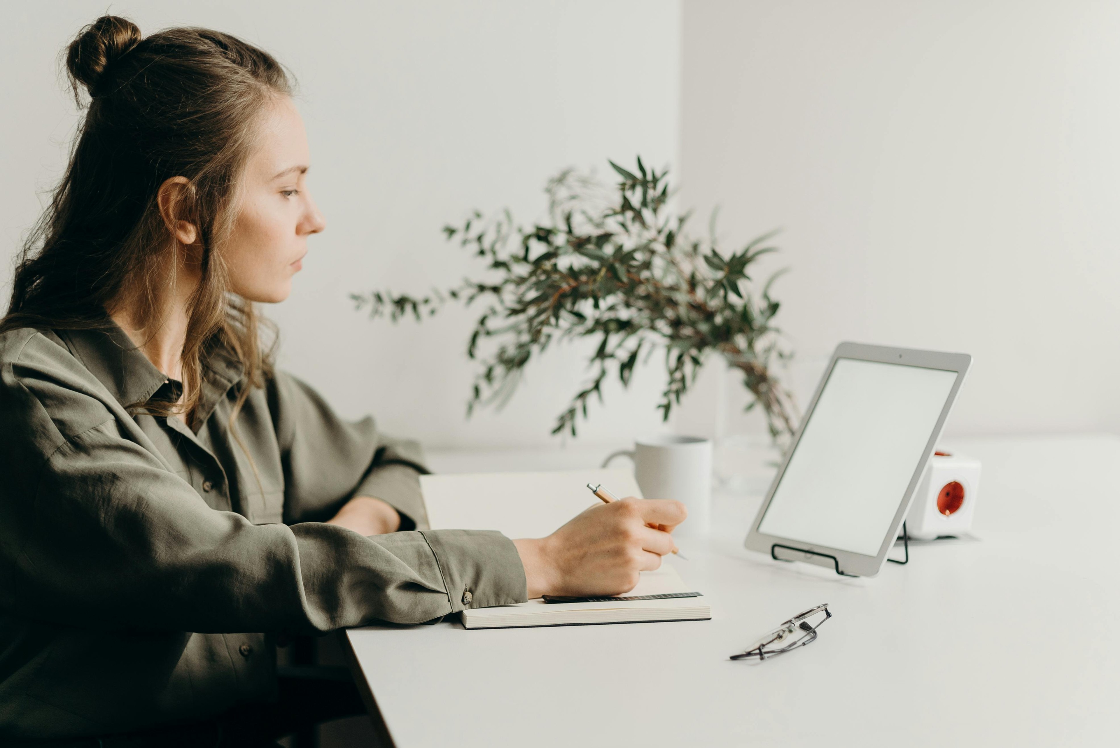 Girl sat in front of laptop