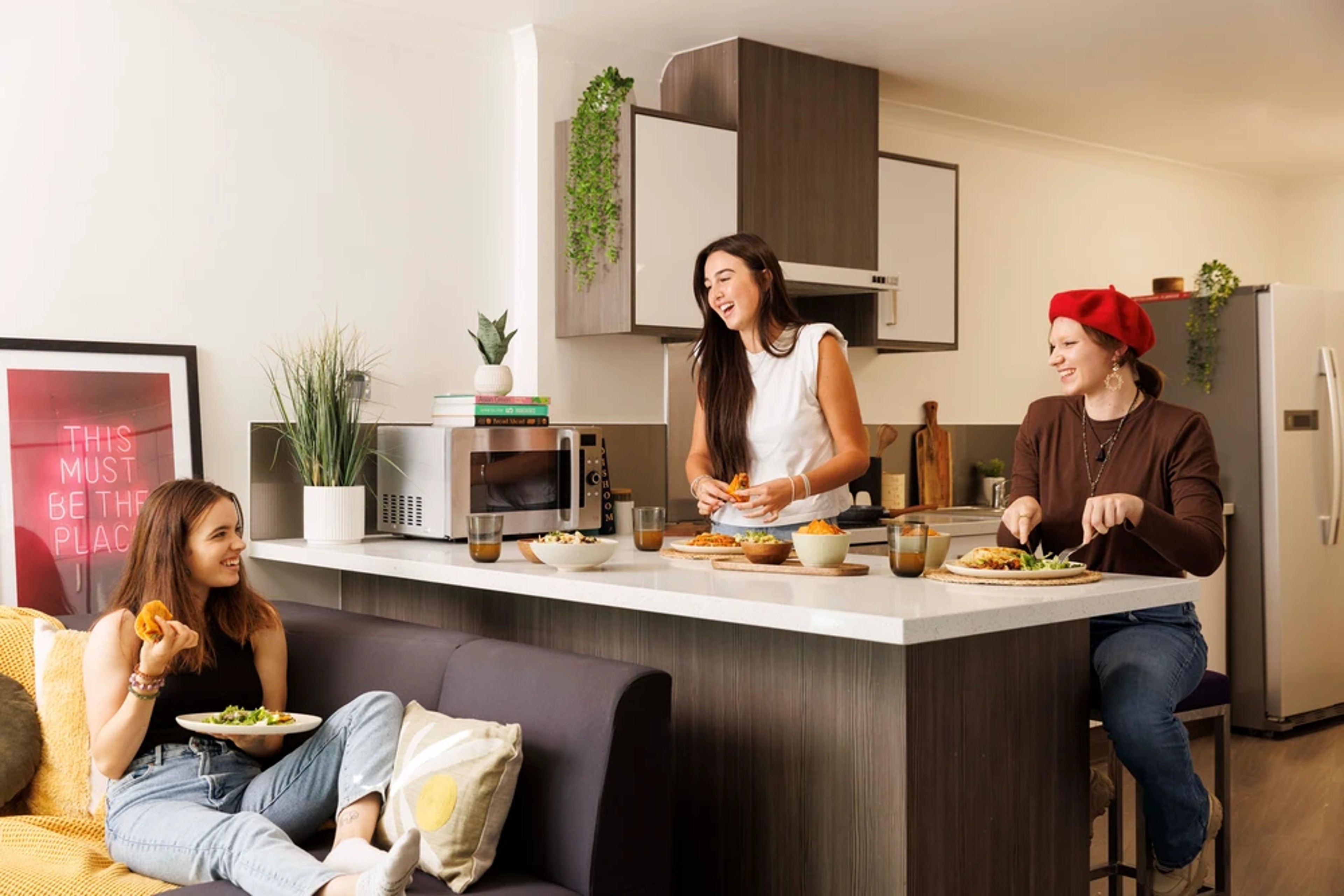 Students using a shared kitchen