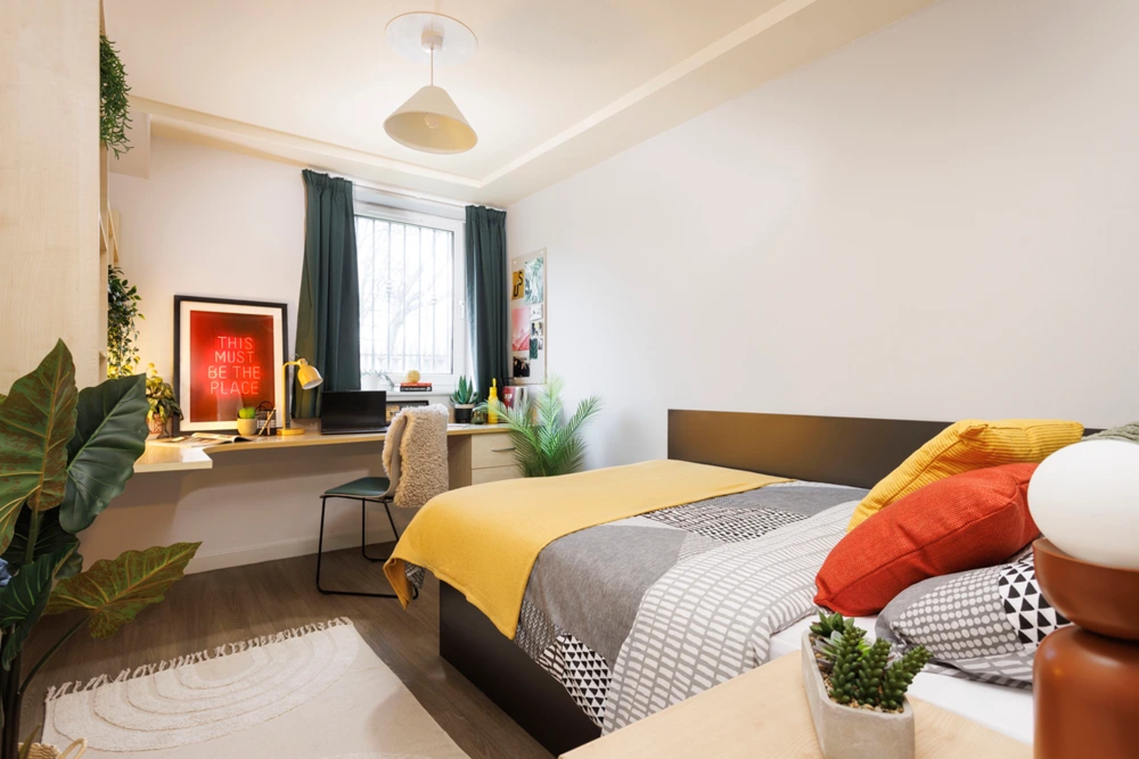 Bed and desk in an Ensuite room