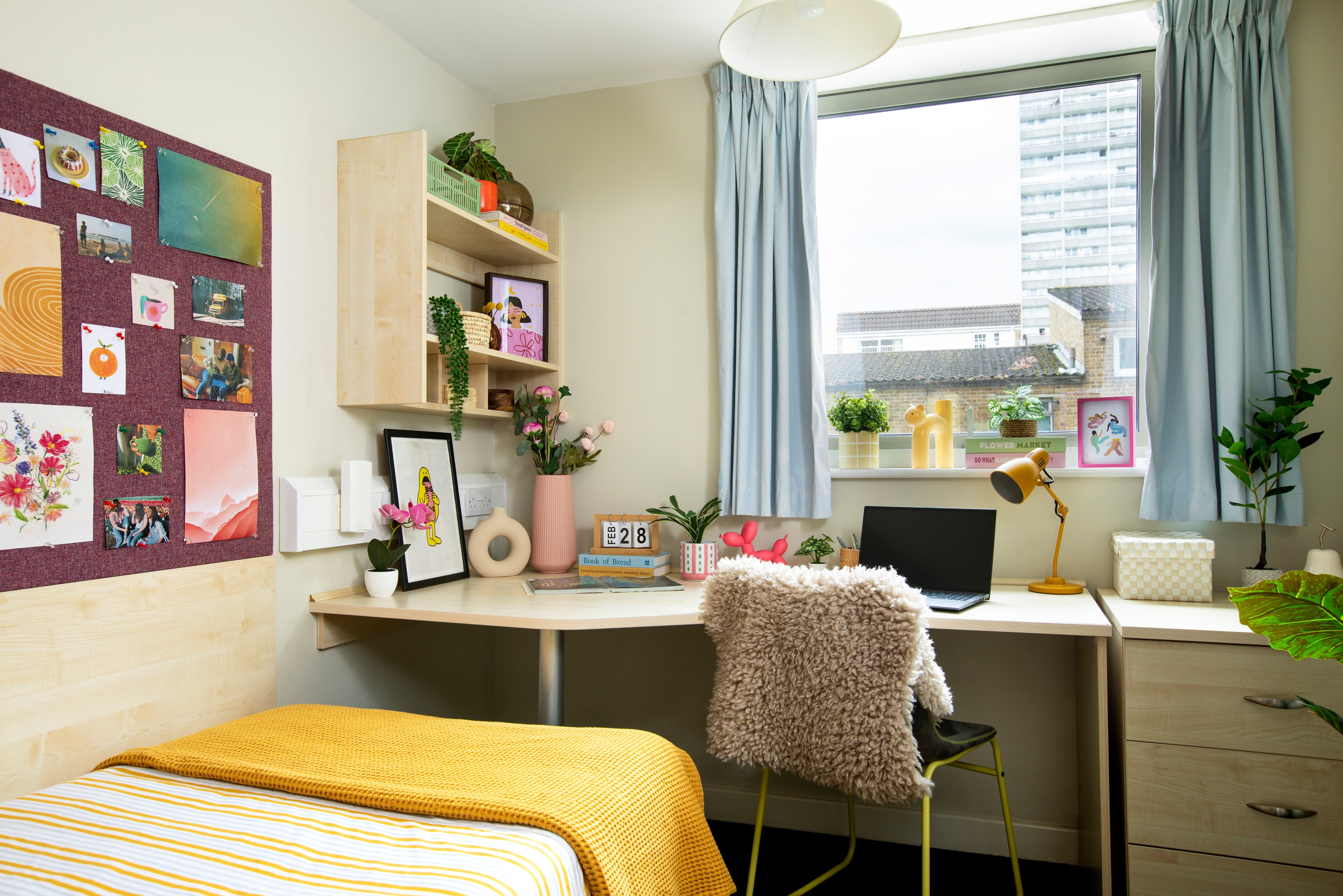 Bed and study space in an en-suite room