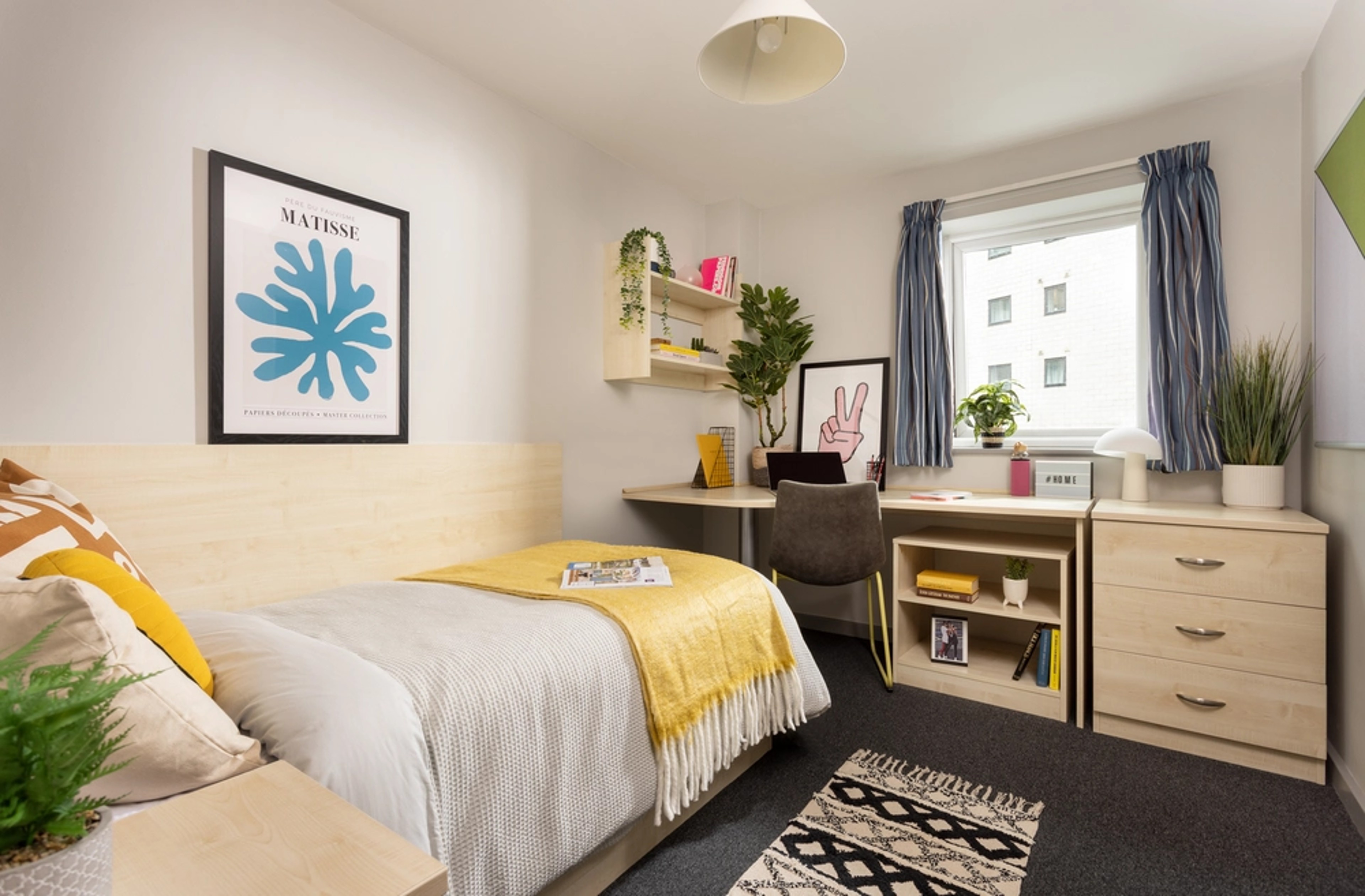 Bed and study space in an En-suite room