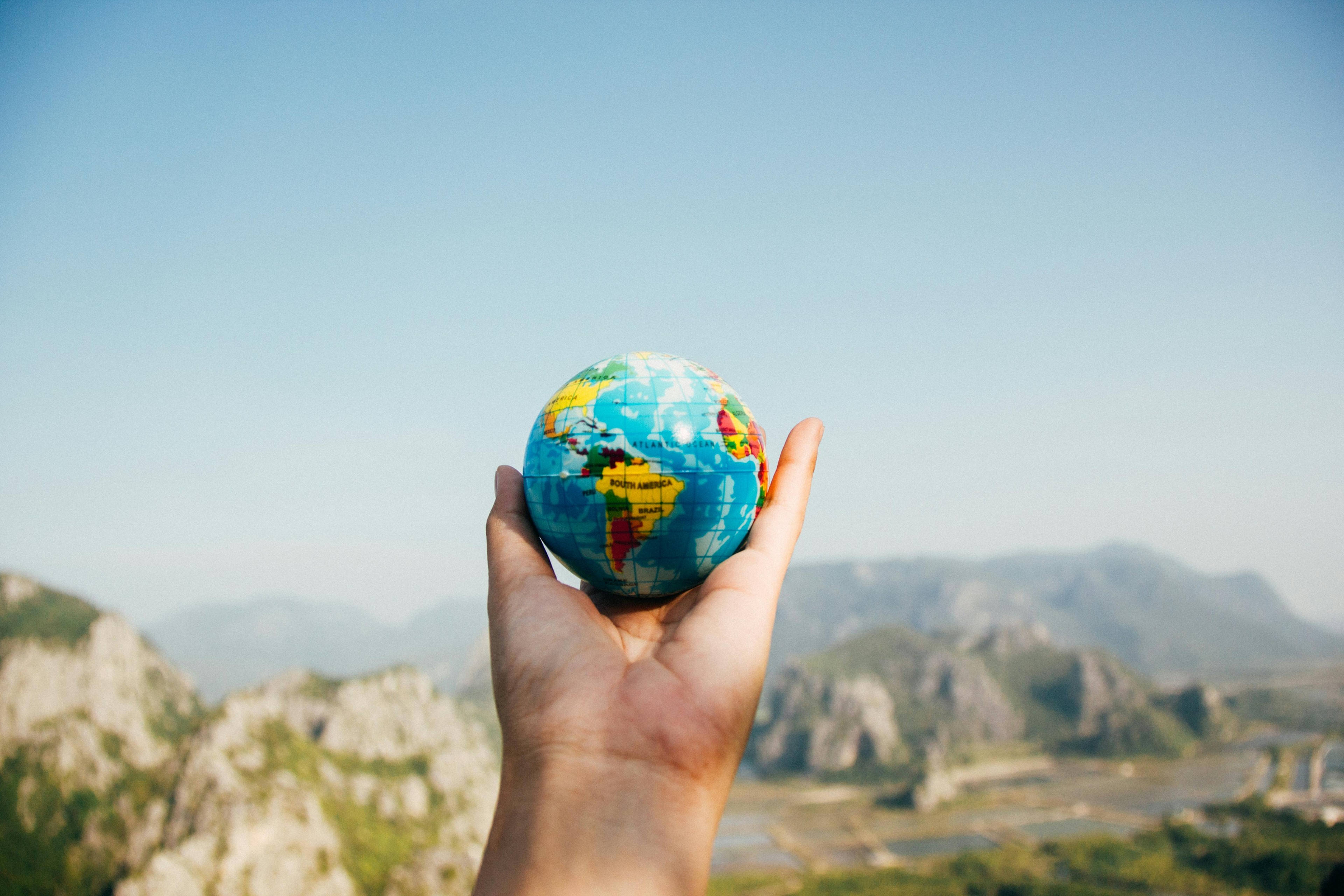 Mountain background holding the world