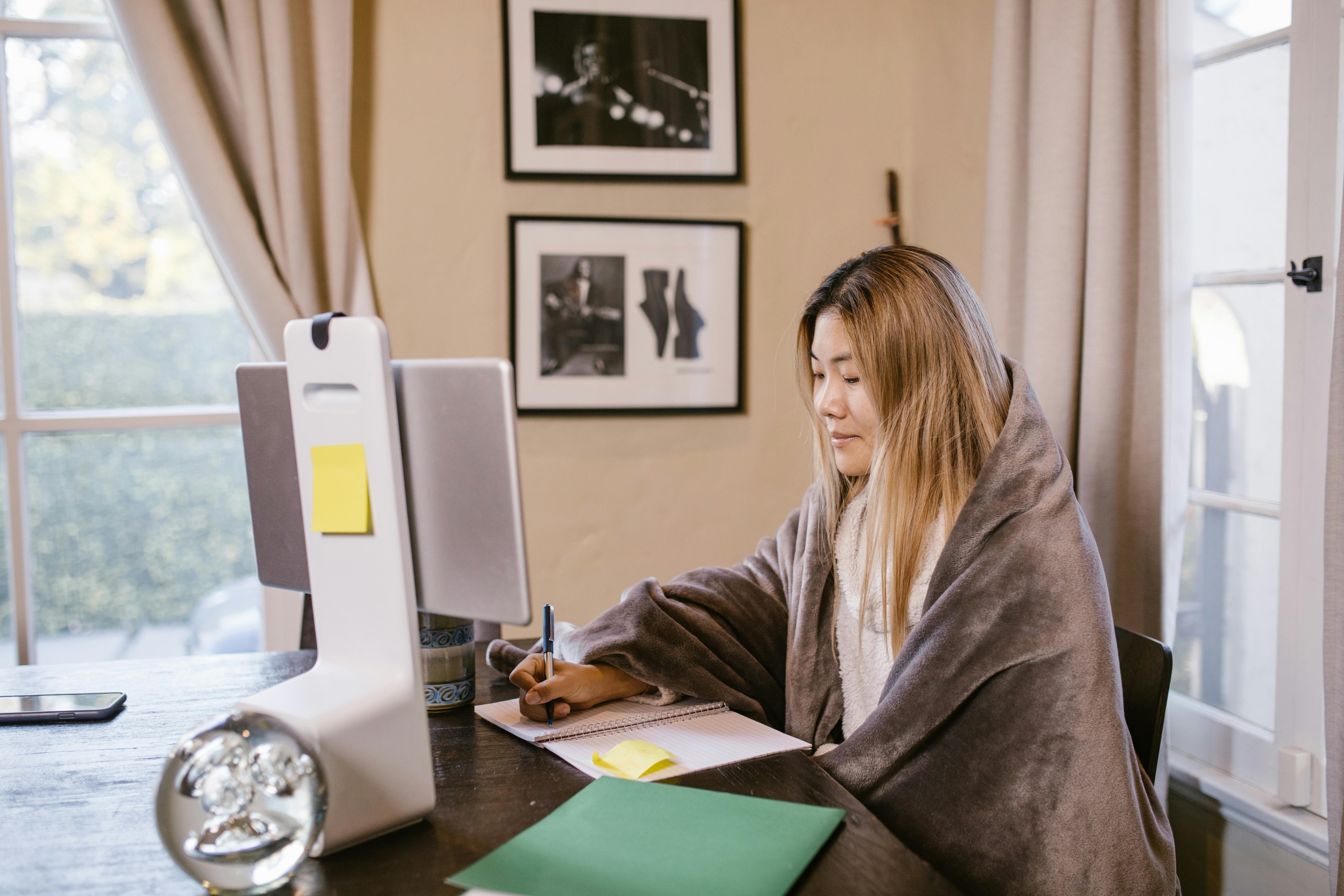 Uni student sat at desk on laptop