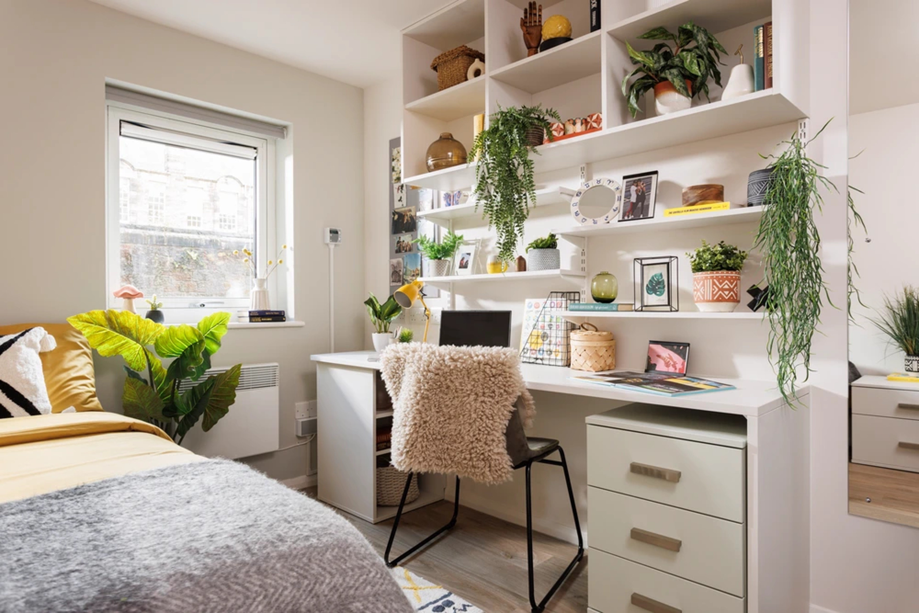 Bed and study space in a Non En-suite