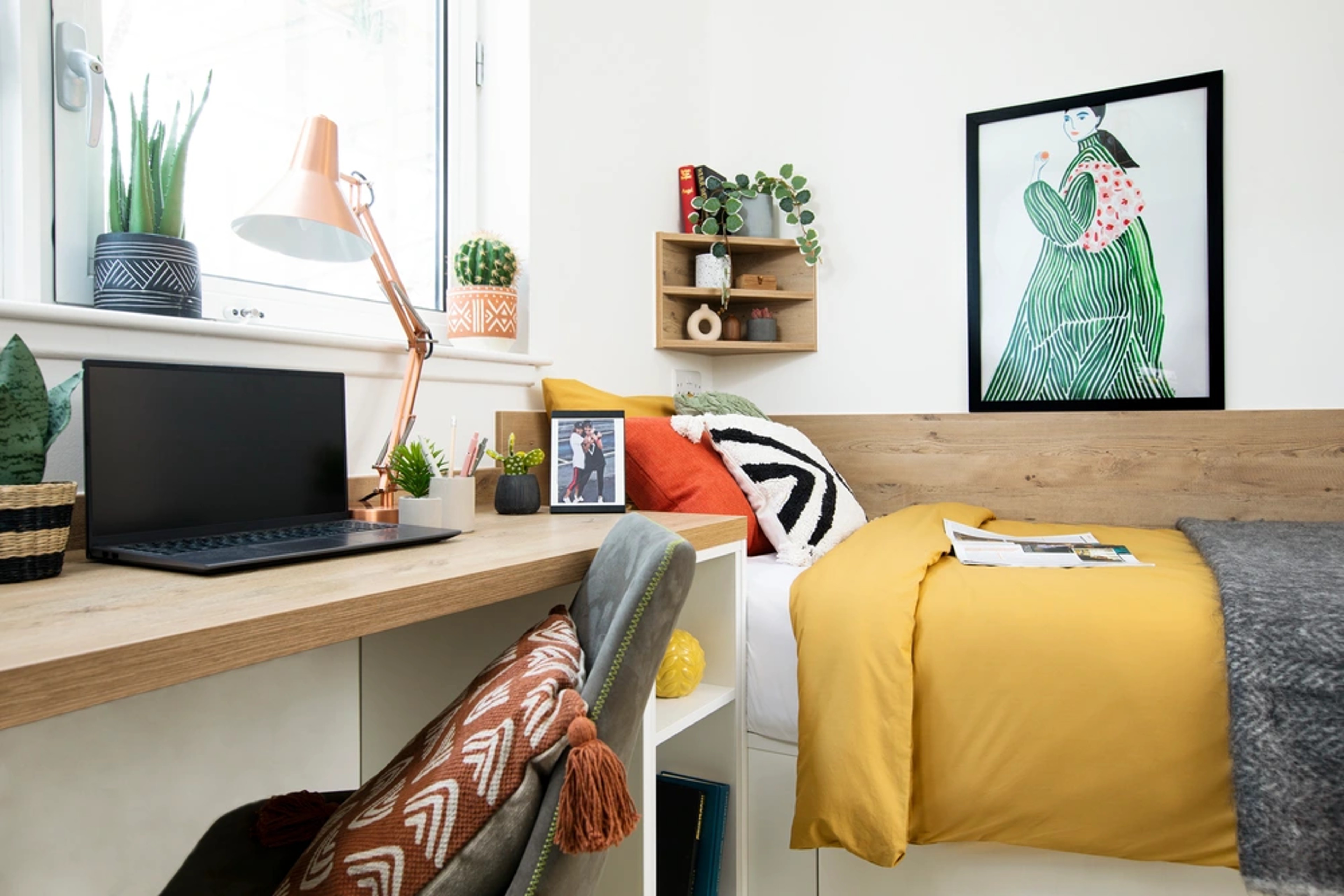 Bed and study space in a Studio