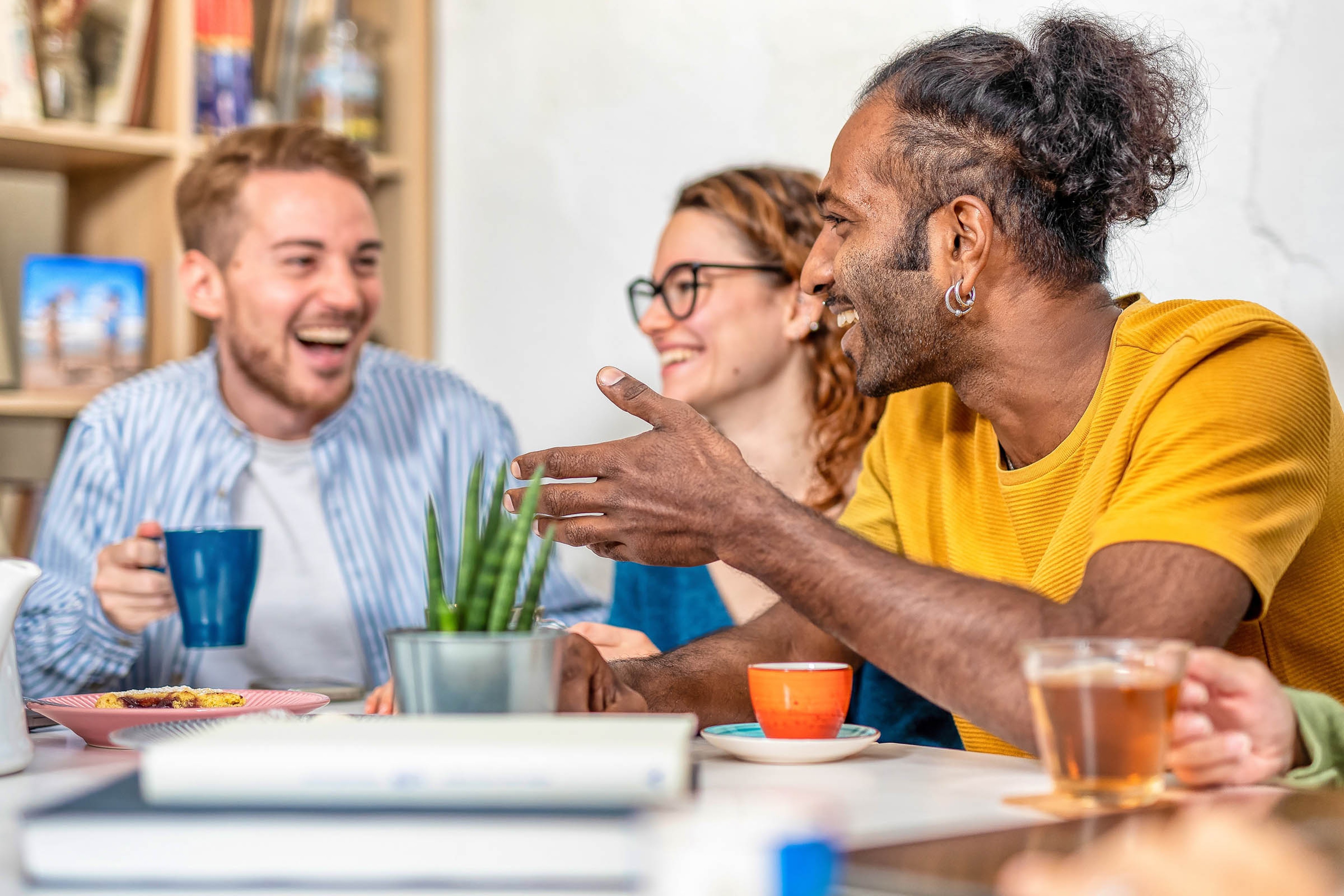 Friends sat around drinking coffee
