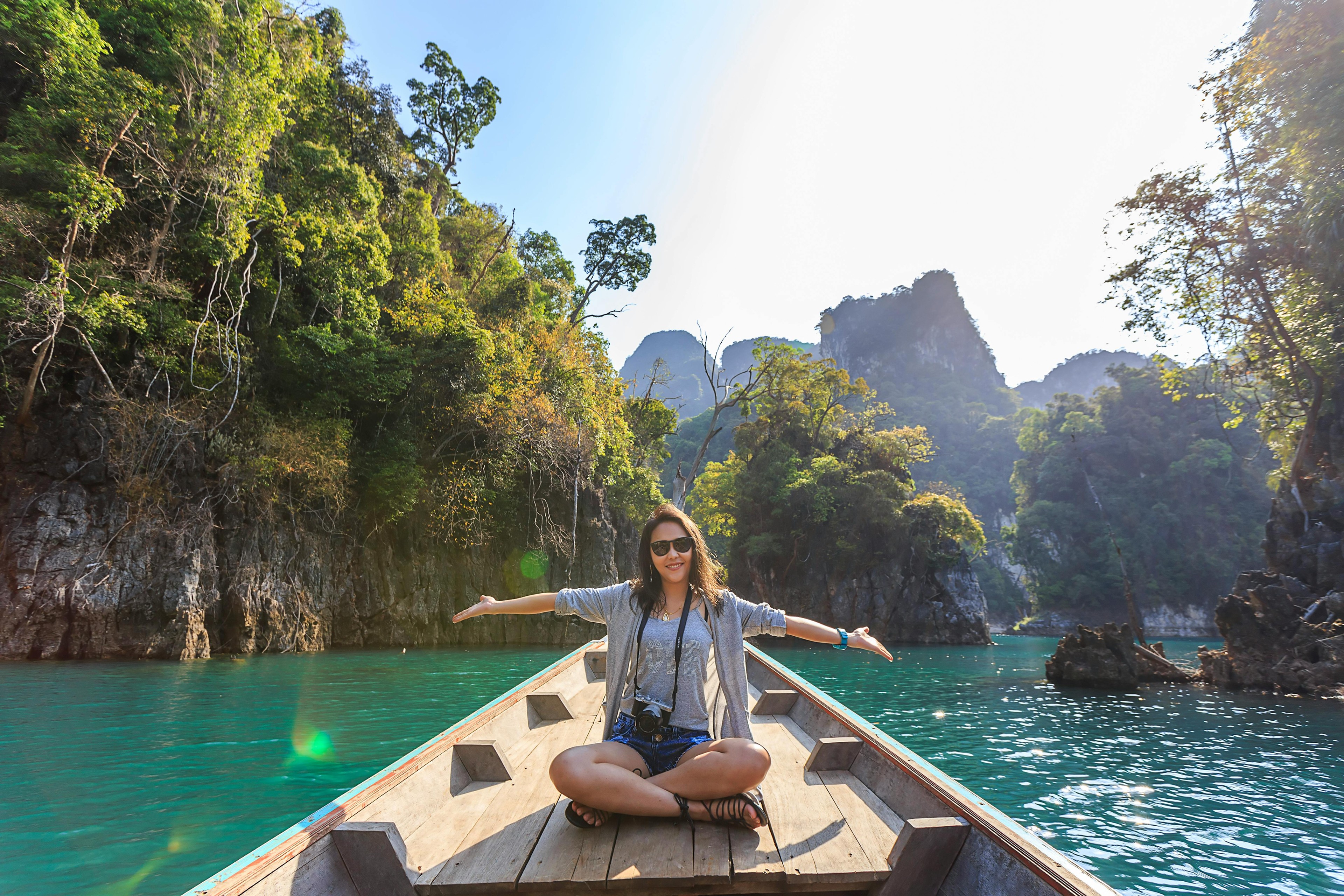 Girl sat on boat on a lake