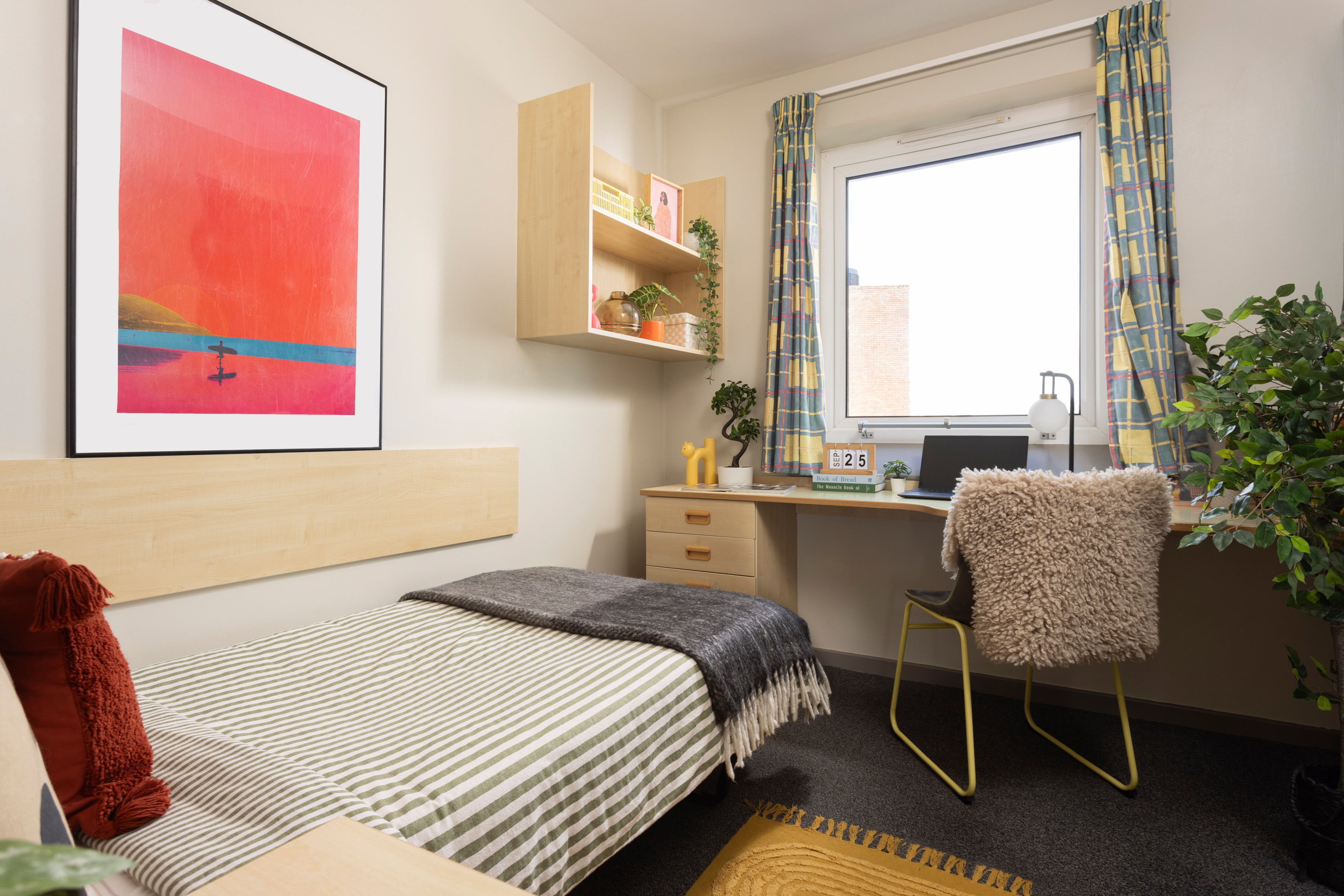 Bed and study space in an en-suite room