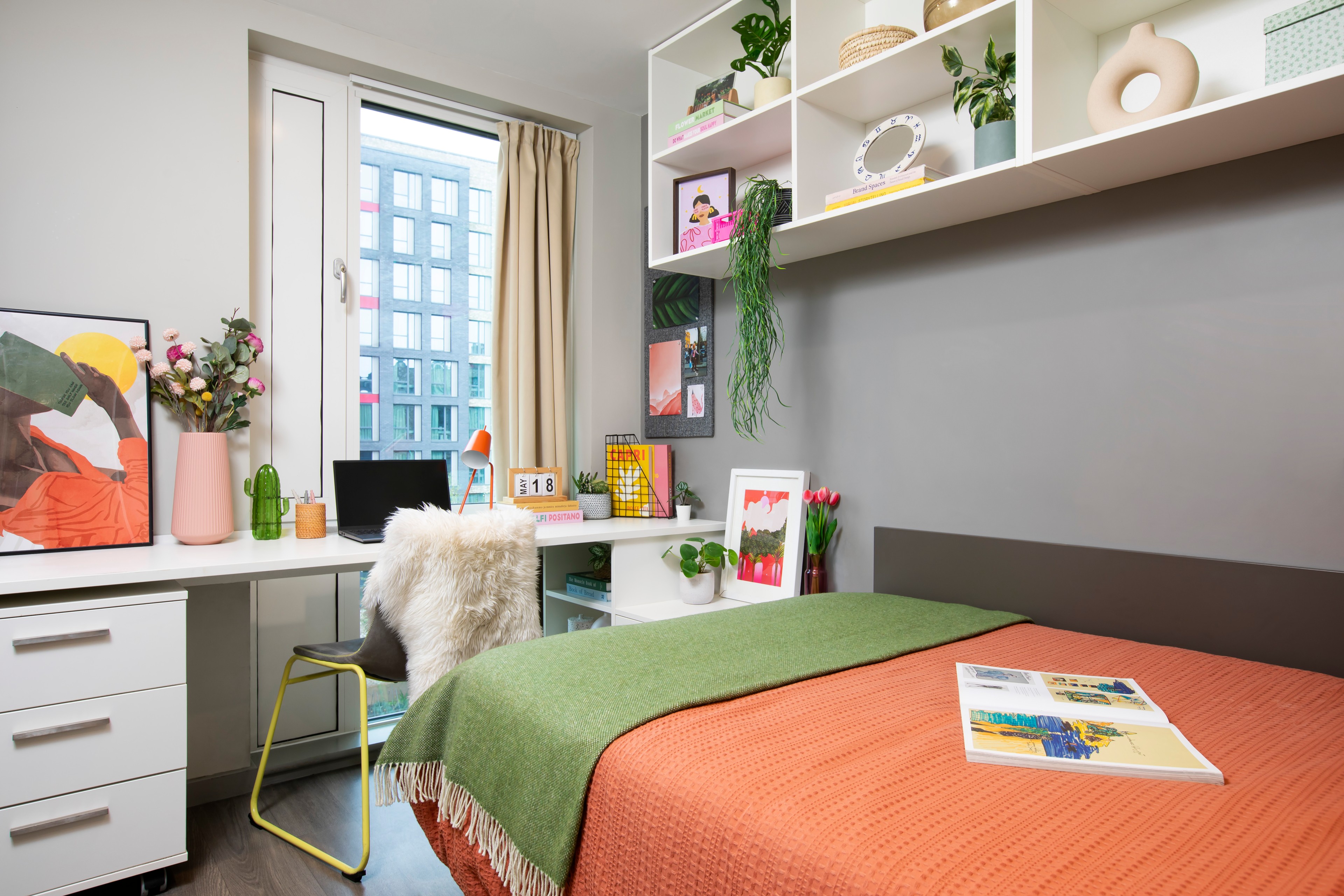 Bed and desk in an en-suite room