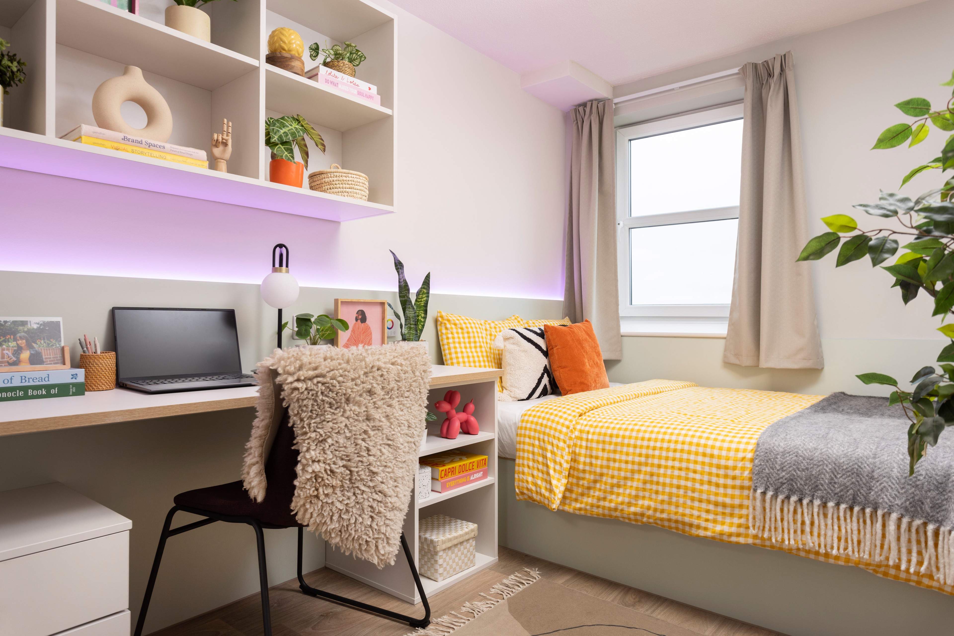 Bed and study area in en-suite room