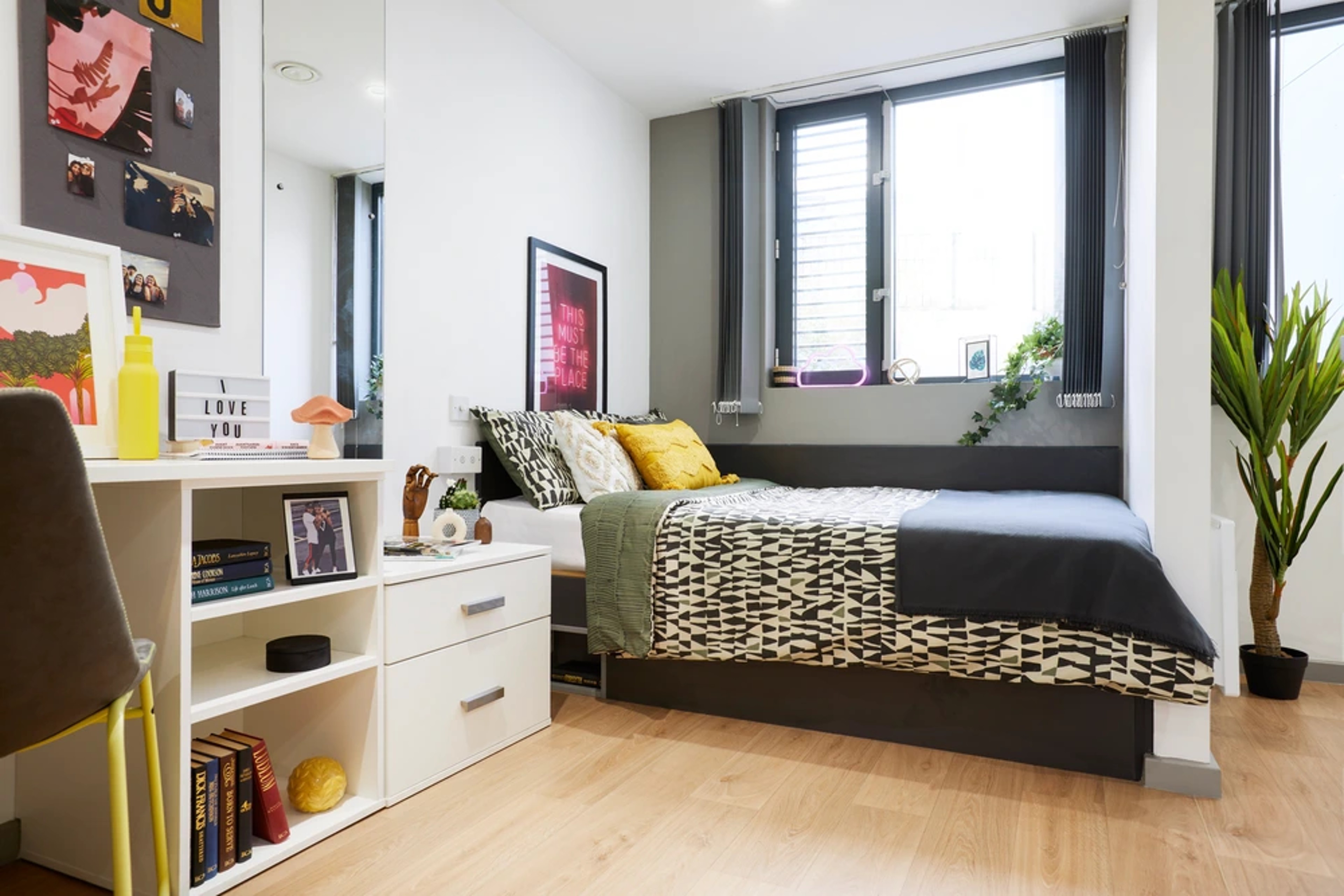 Bed and desk in an Accessible Studio