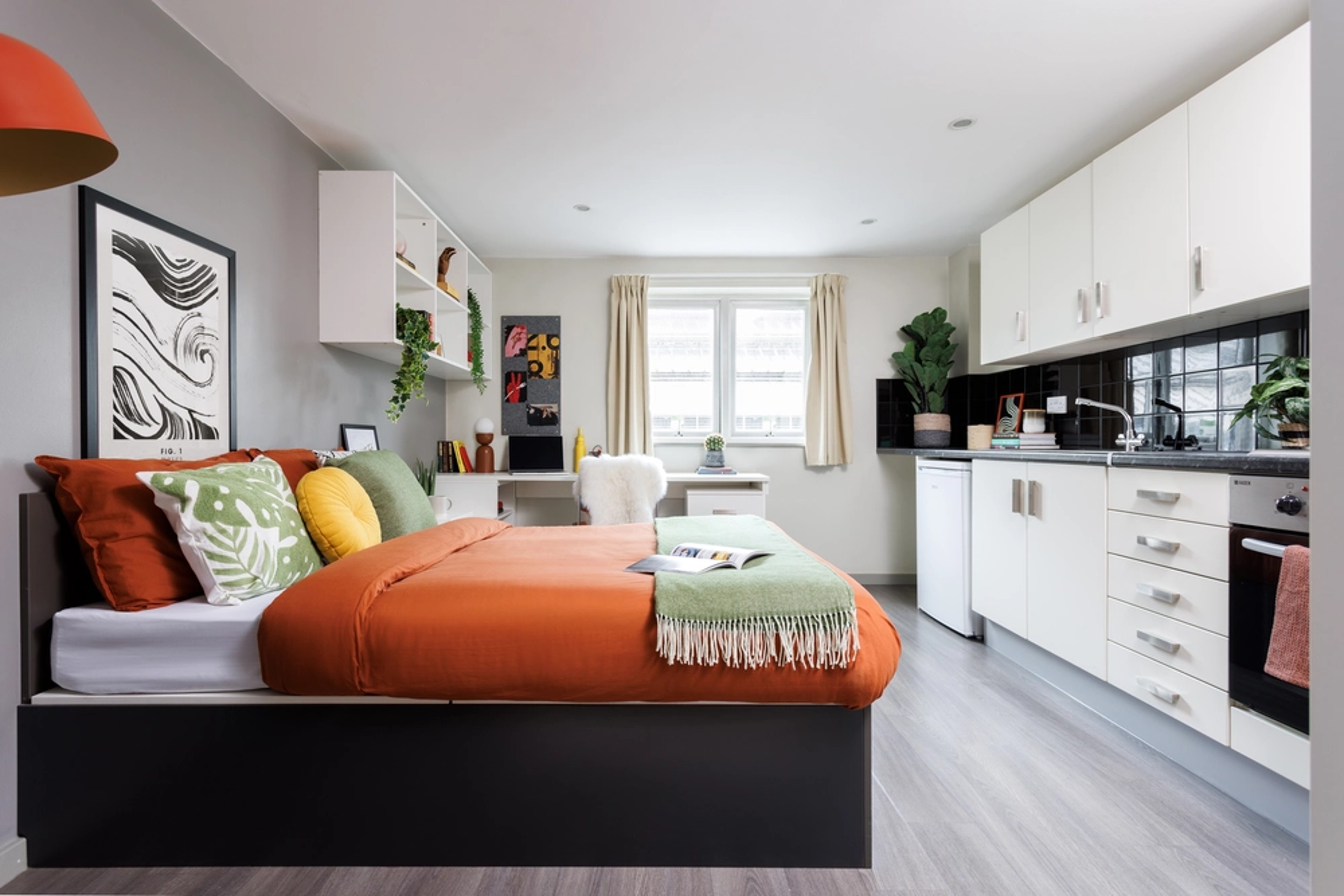 Bed and kitchen in a Studio