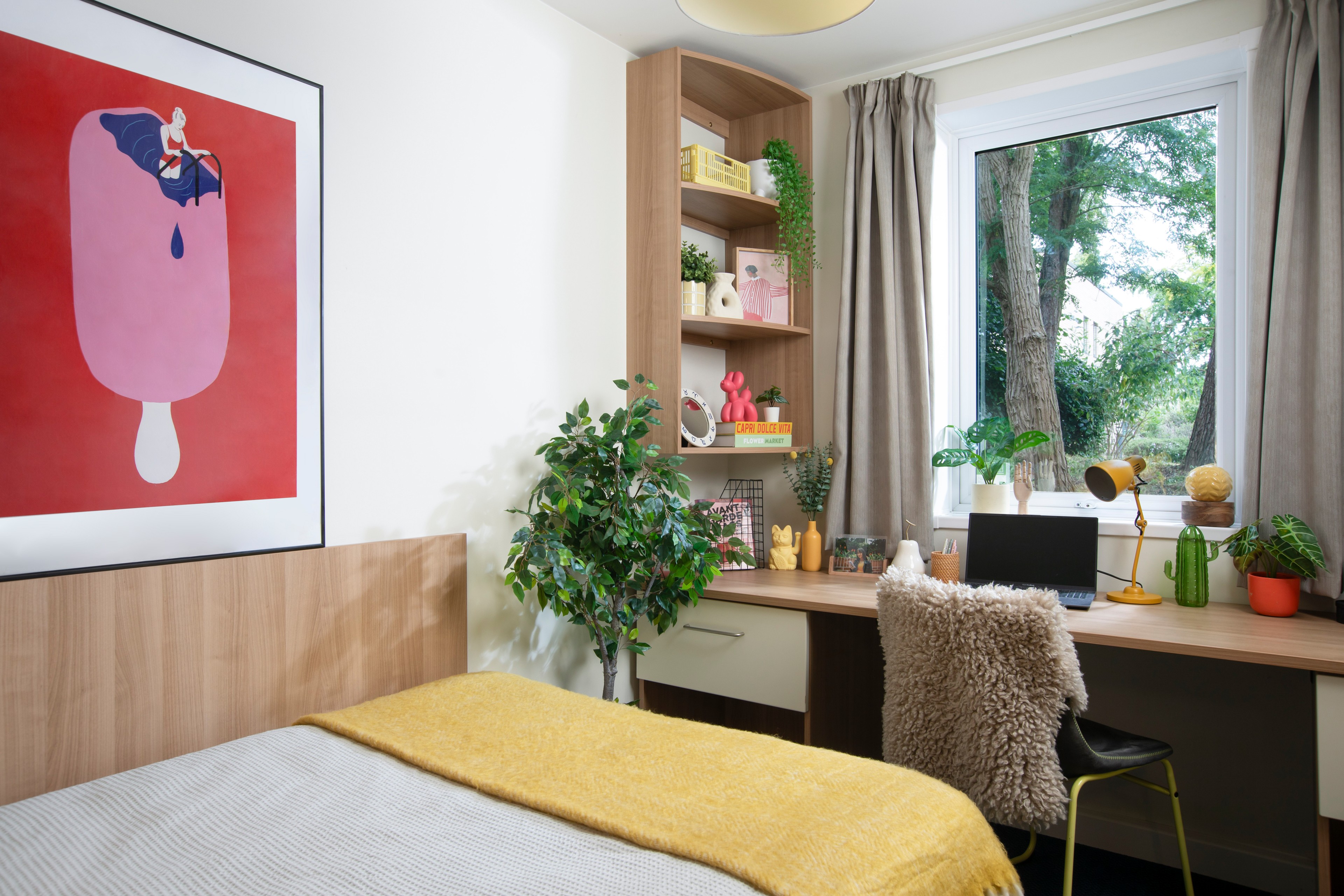 Bed and study space in an En-suite room