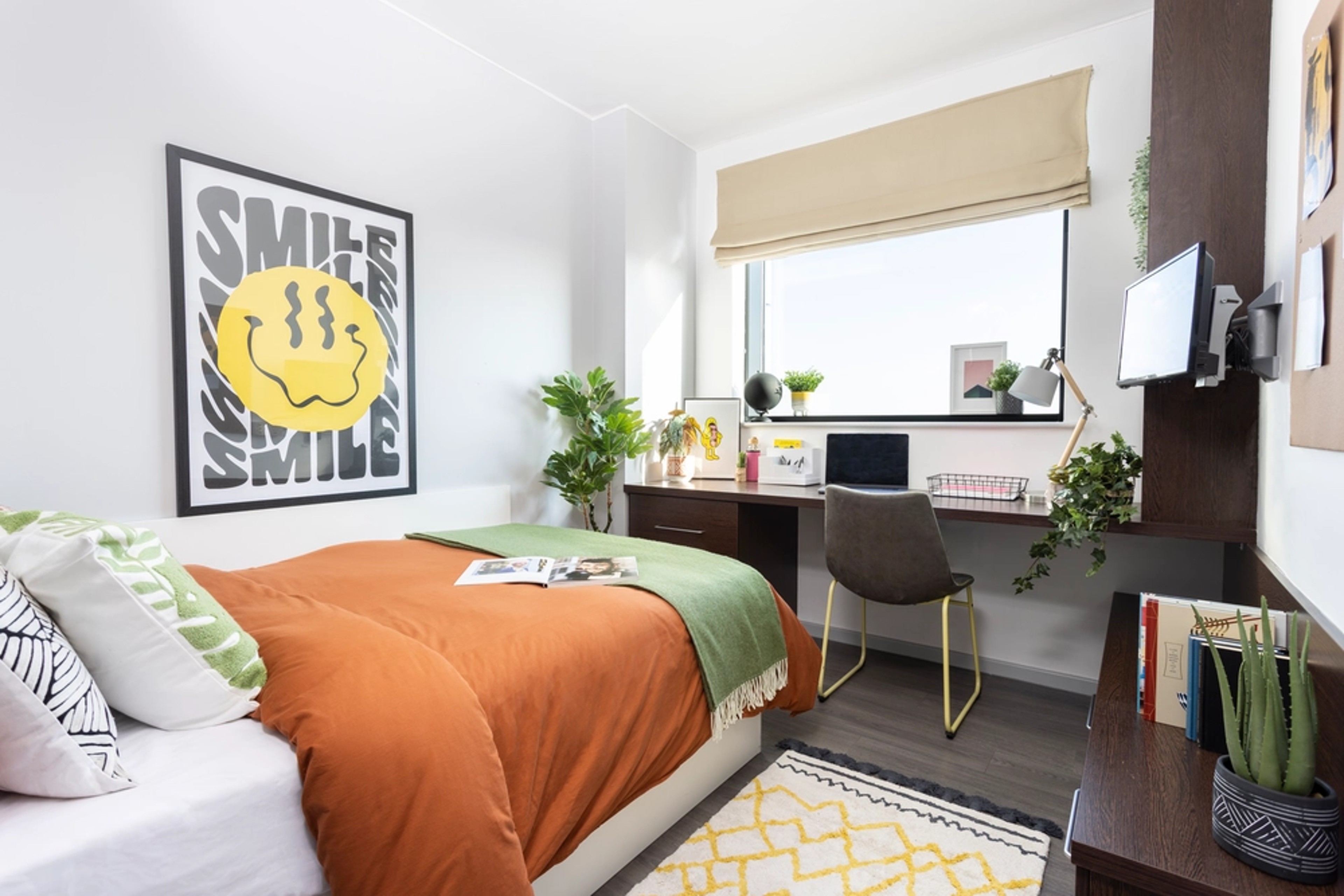 Bed and study space in an En-suite room