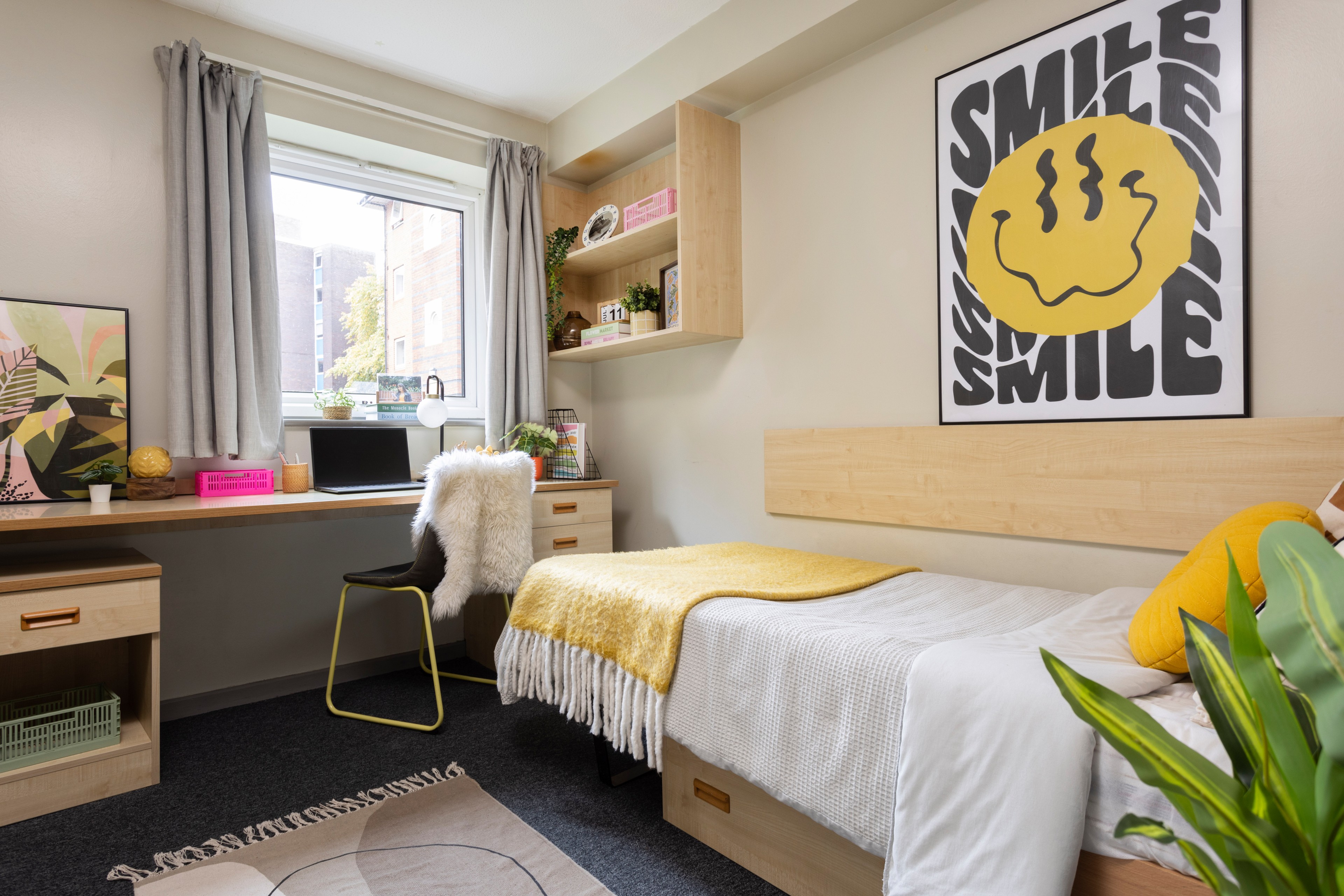 Bed and study space in an en-suite room