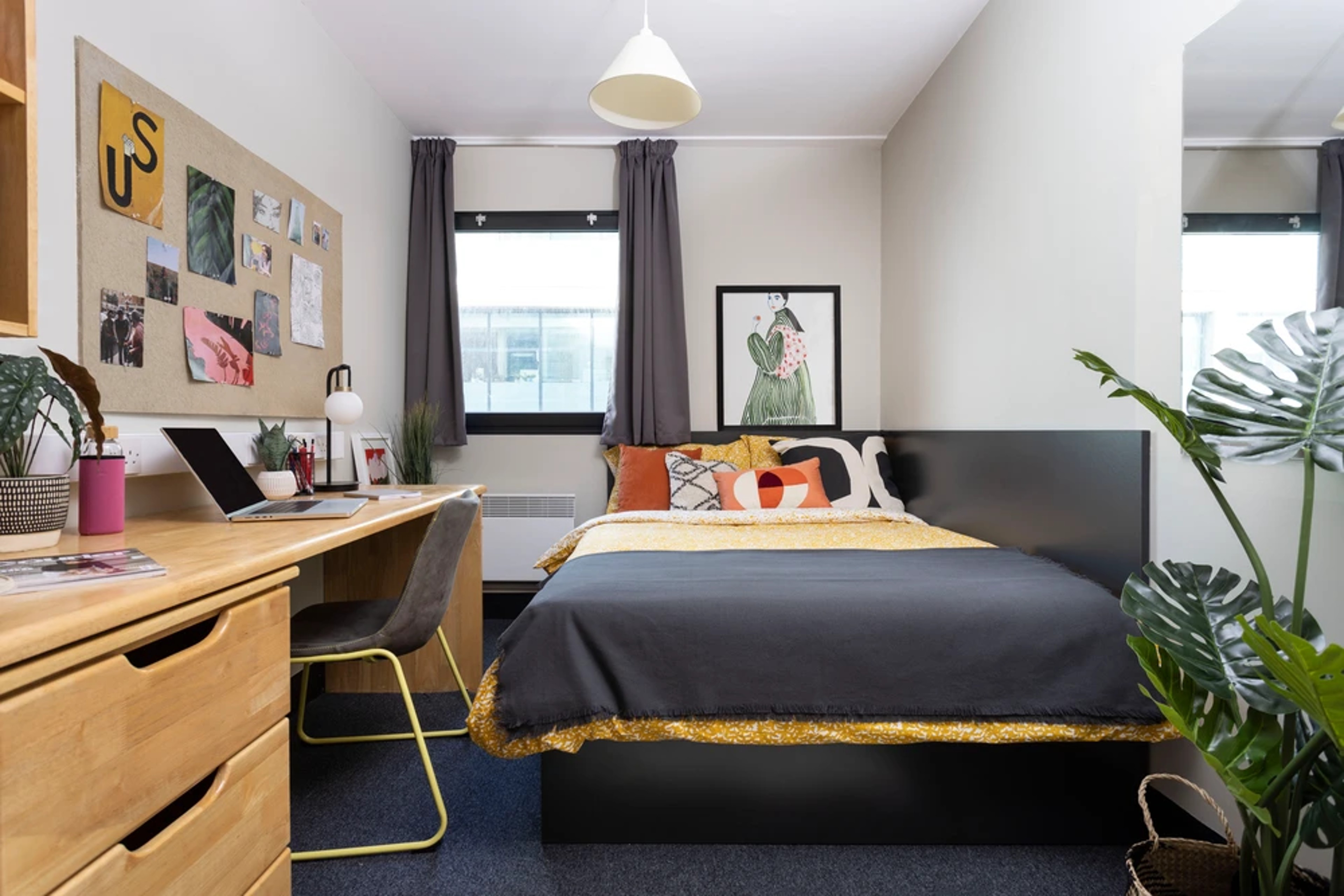 Bed and study space in a Studio