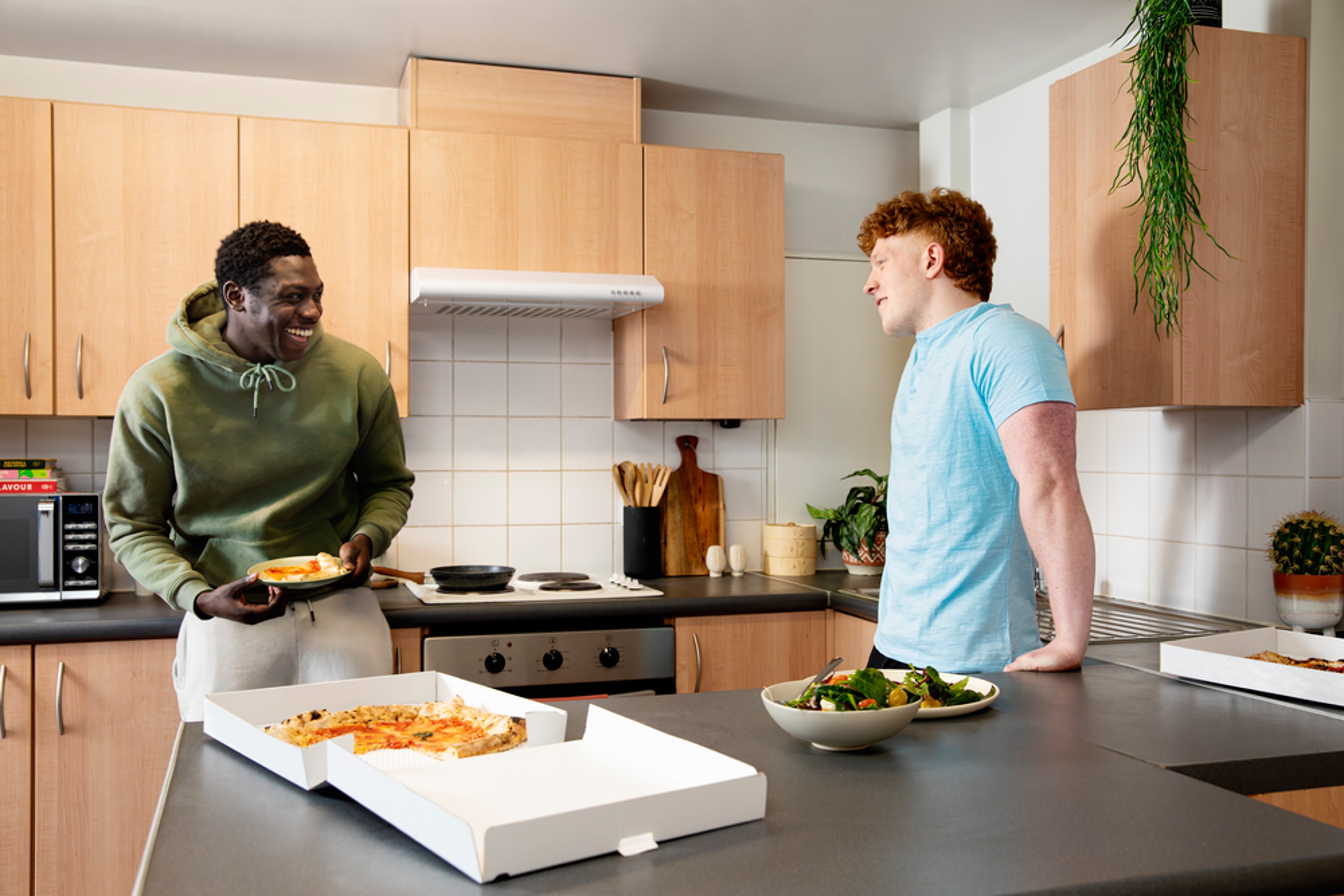 Students in the shared kitchen