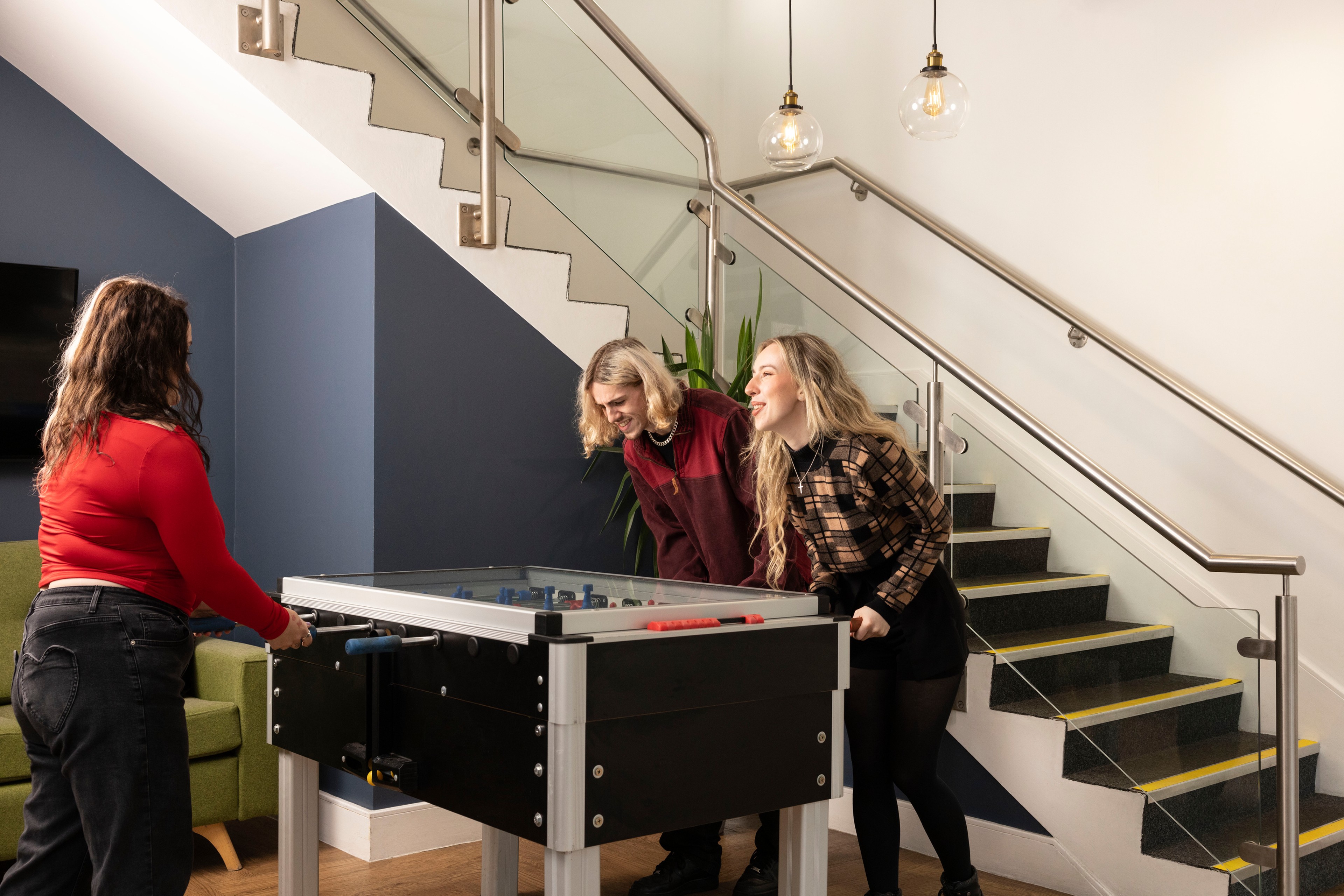 Students playing games in the foyer