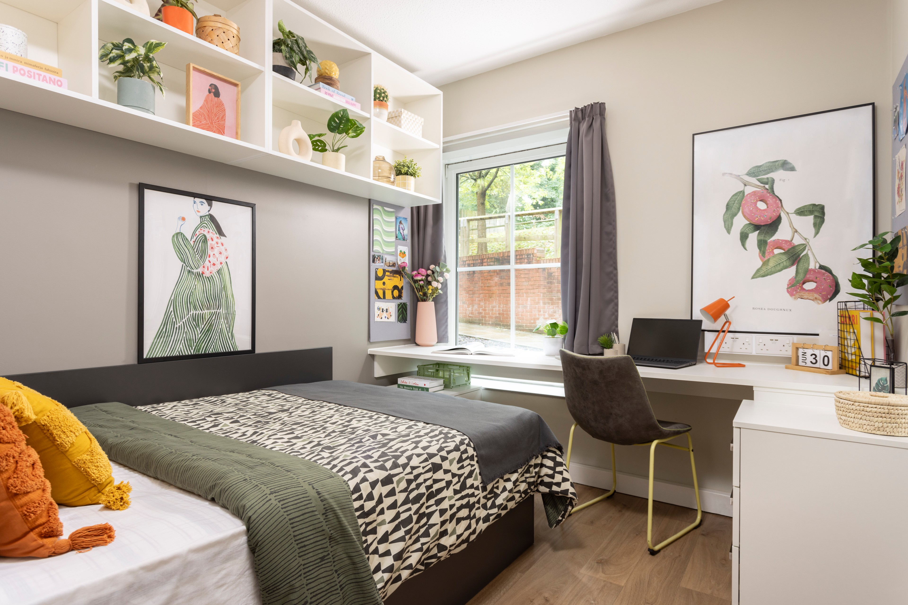 Bed and study space in an En-suite room