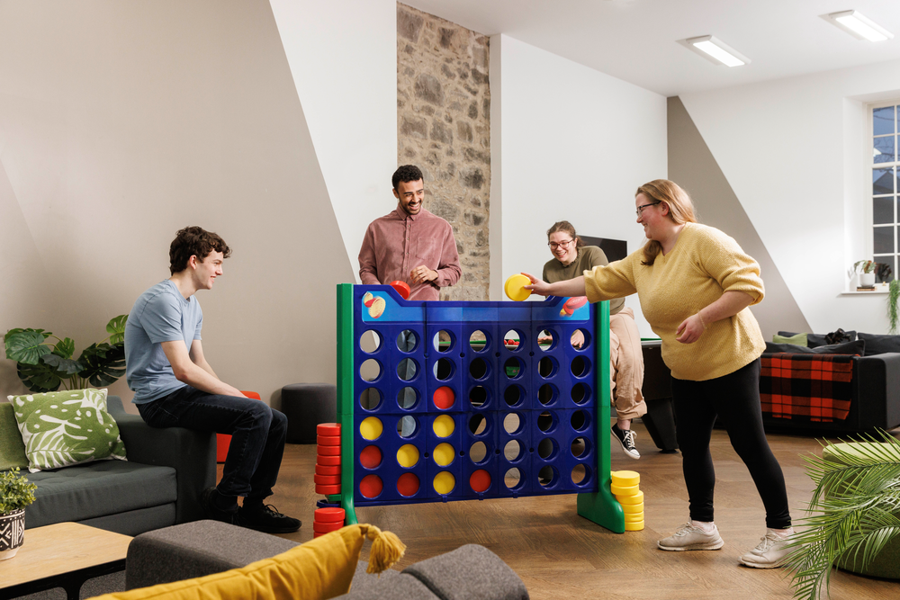 Students playing in the games area