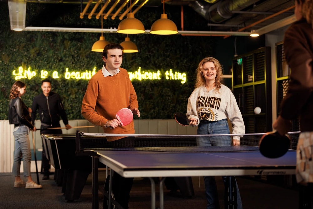 Students playing table tennis