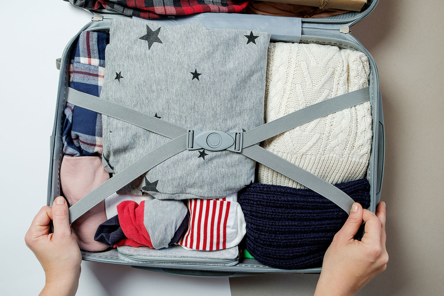 Photo of a packed suitcase with clothes