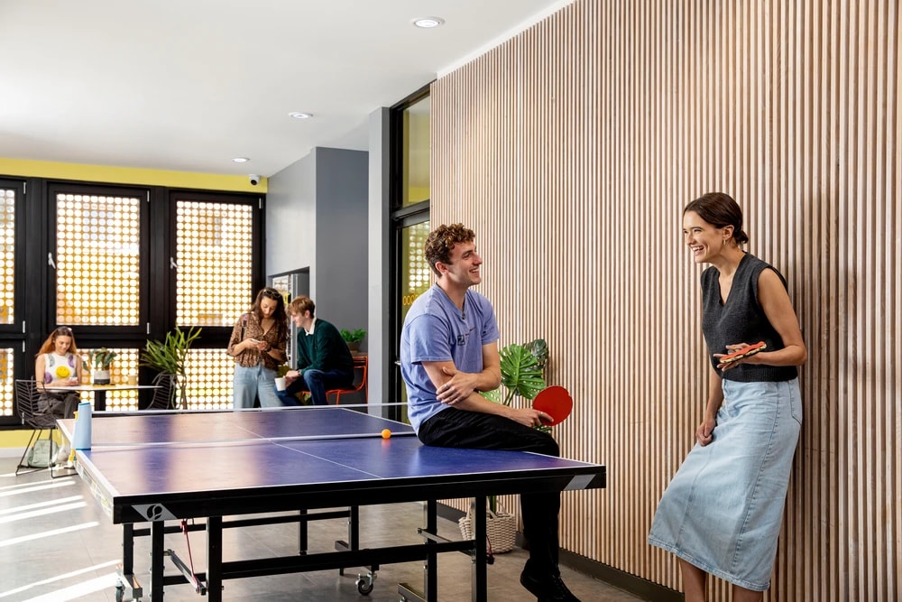 Students in game room at Blackweir Lodge