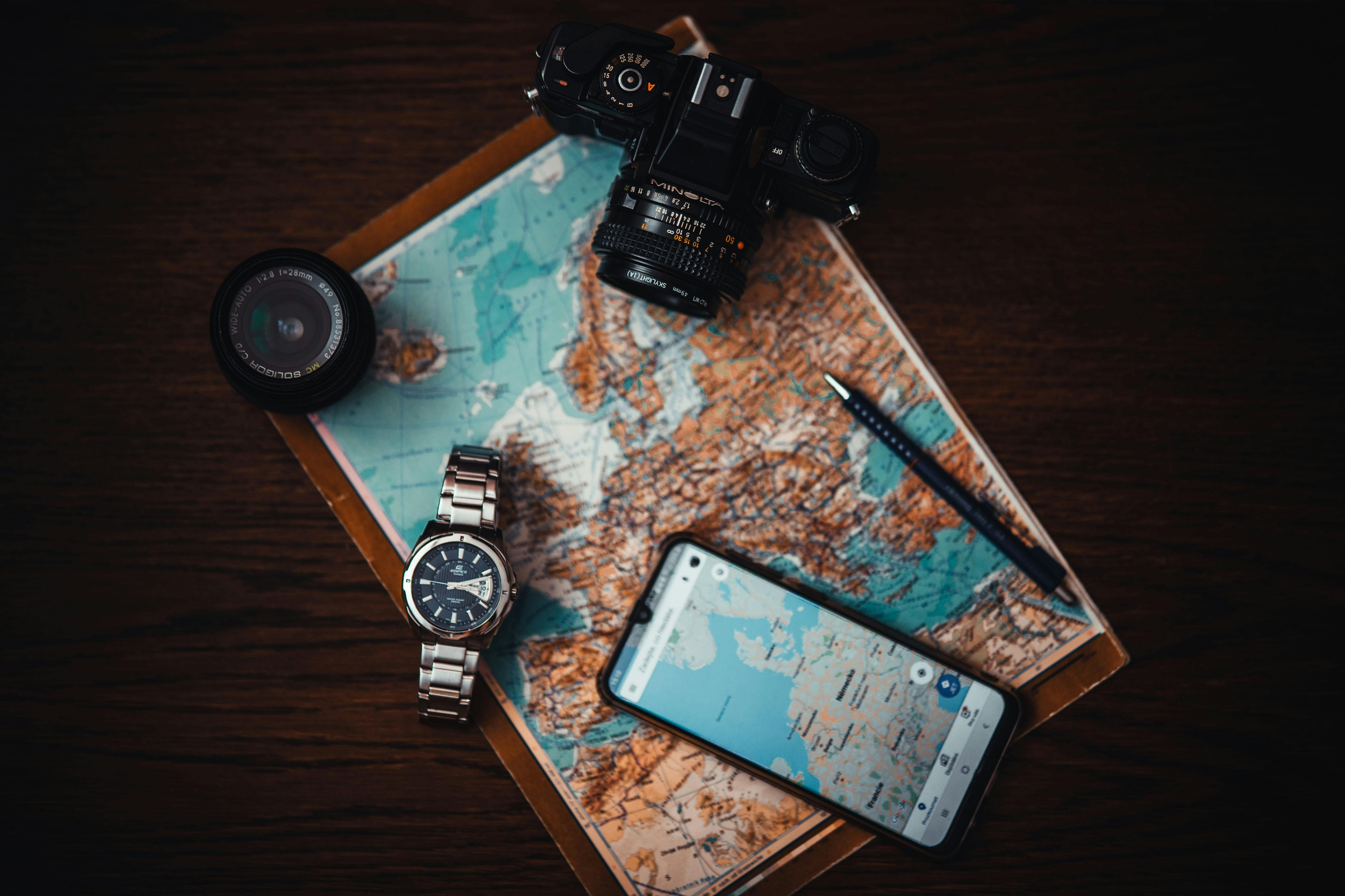 Photo of map, camera and gadgets