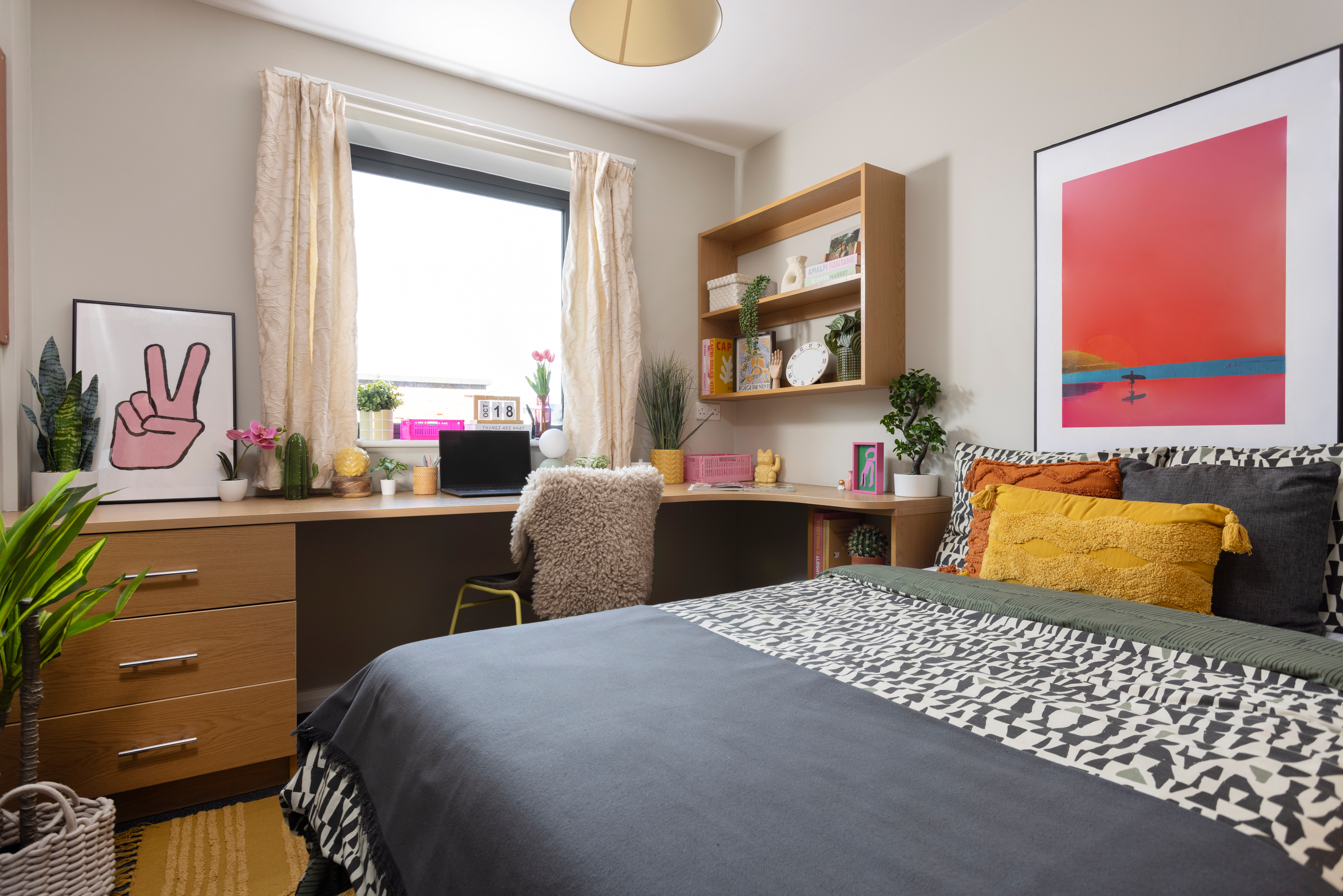 Bed and study space in an En-suite room