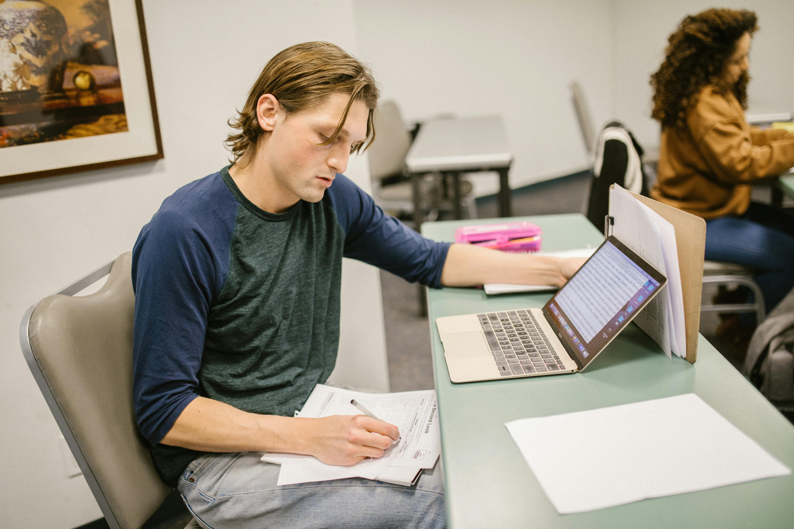 Man making notes at desk