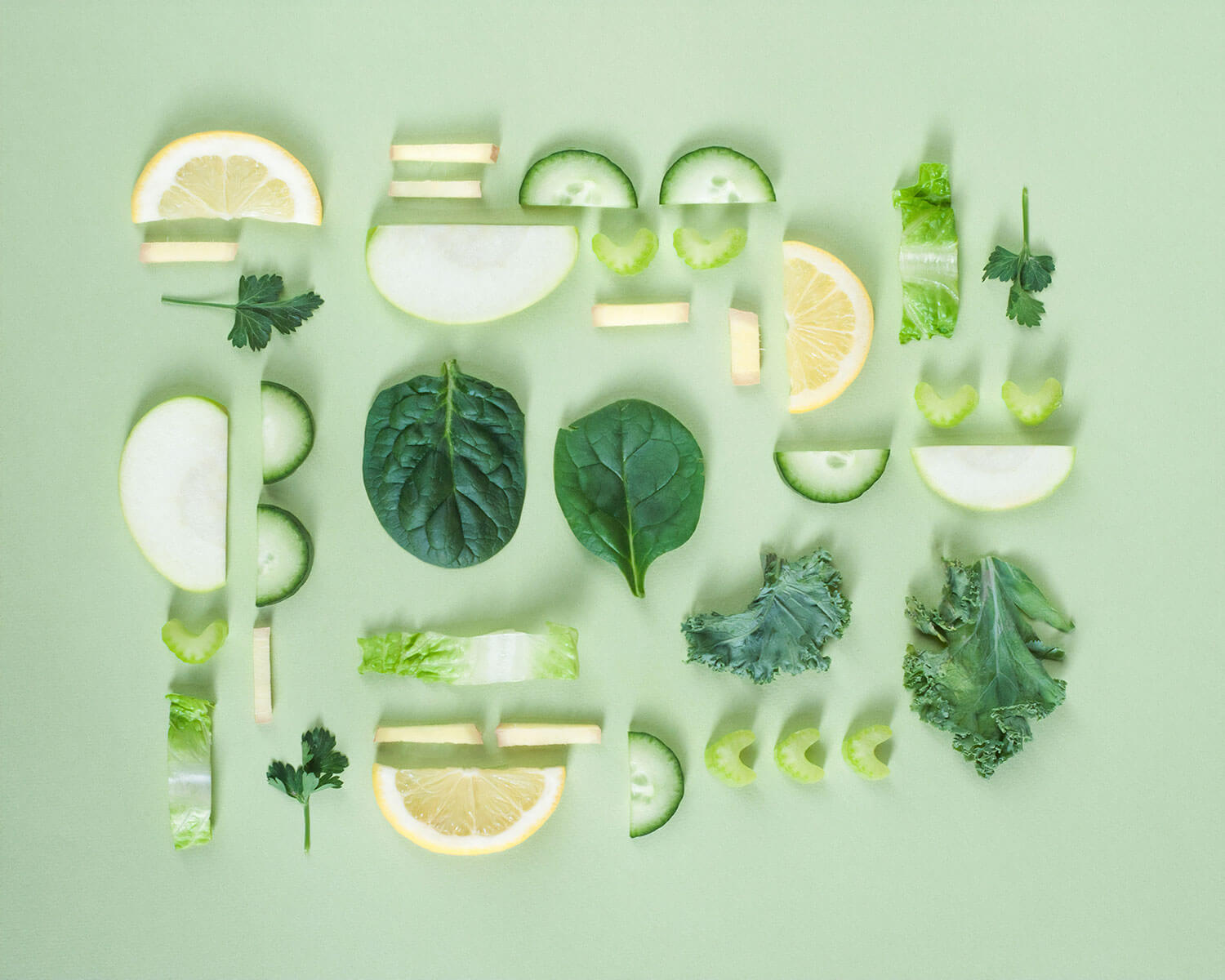 Sliced vegetables on a green background