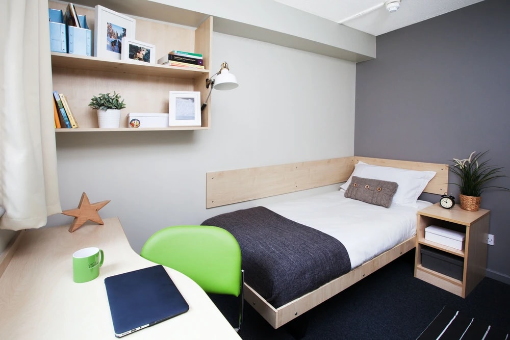 Bed and study space in an En-suite room