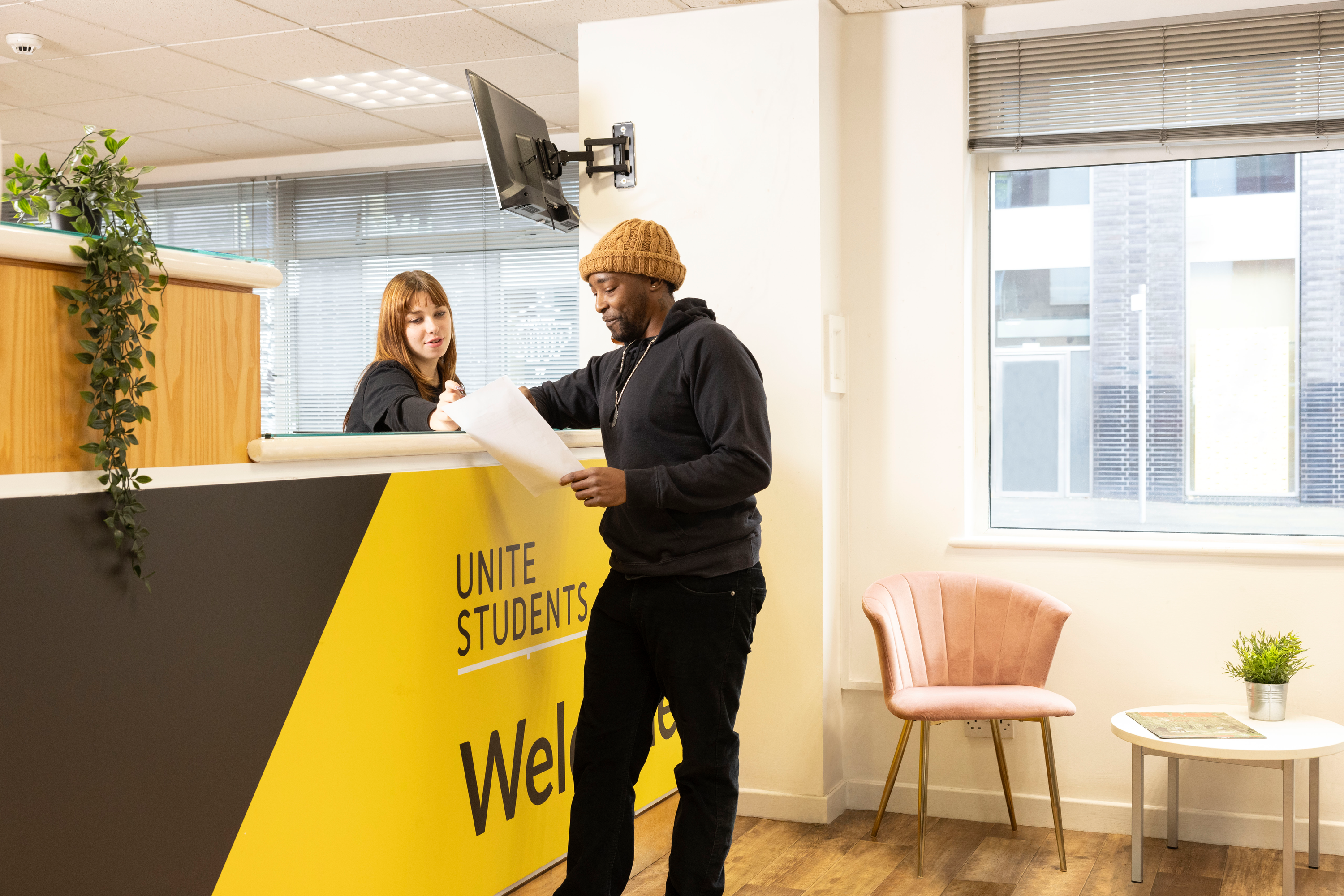 Student and employee in reception area