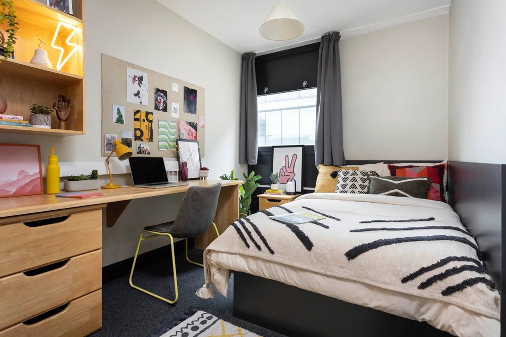 Bed and study space in an En-suite room