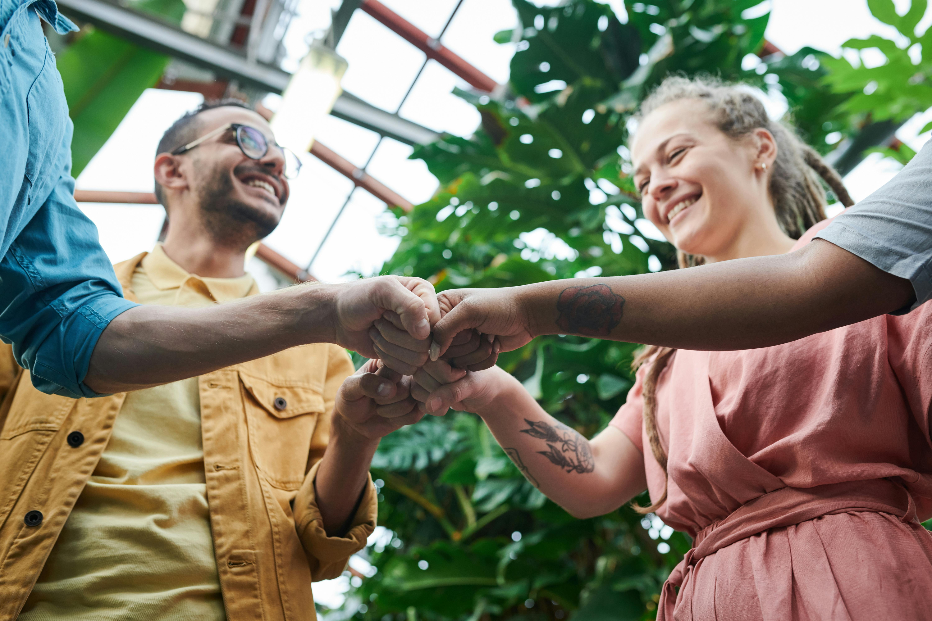 Group of people joining hands