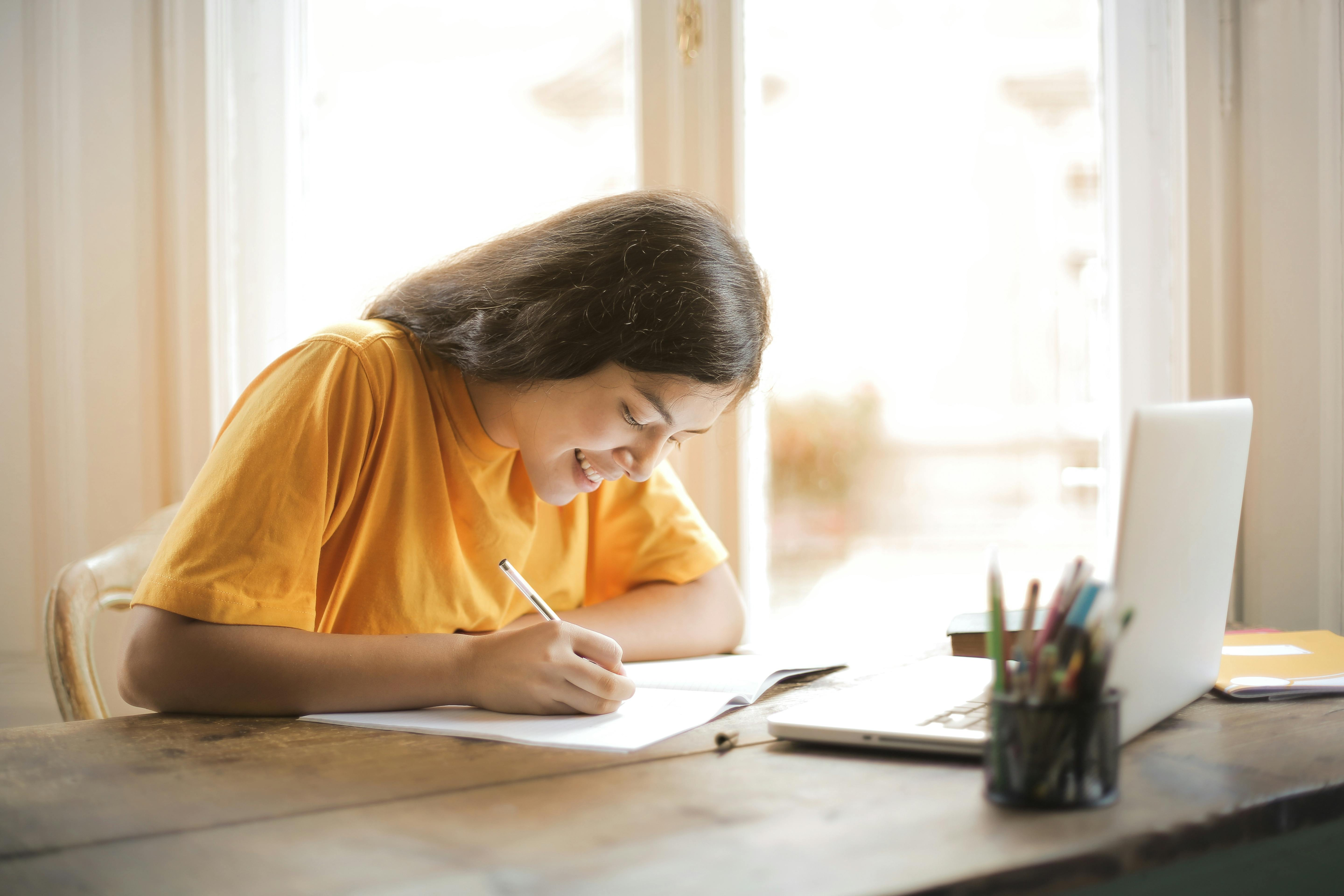 Woman at desk making notes