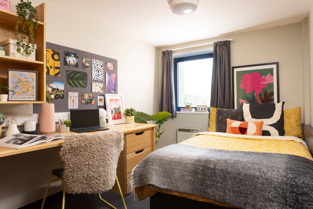 Bed and study space in an En-suite room