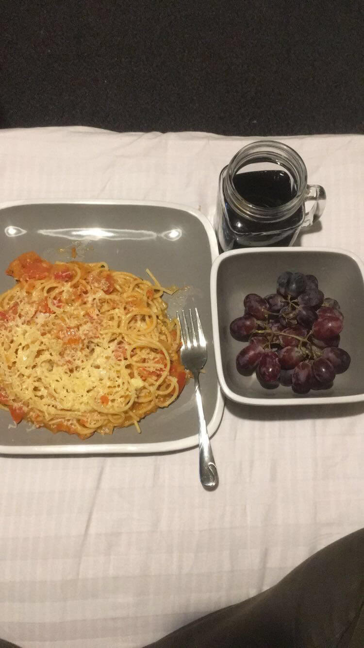 Spagetti, grapes and a drink