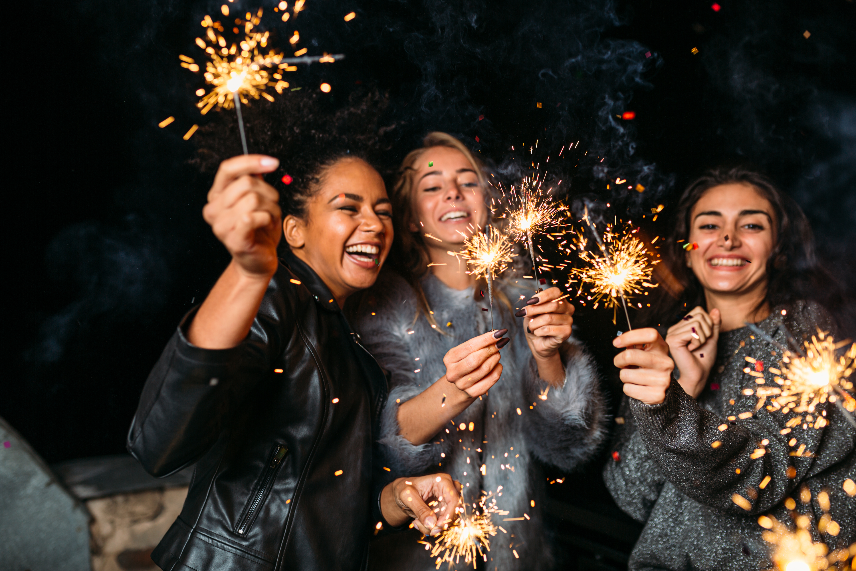 Women holding sparkler fireworks