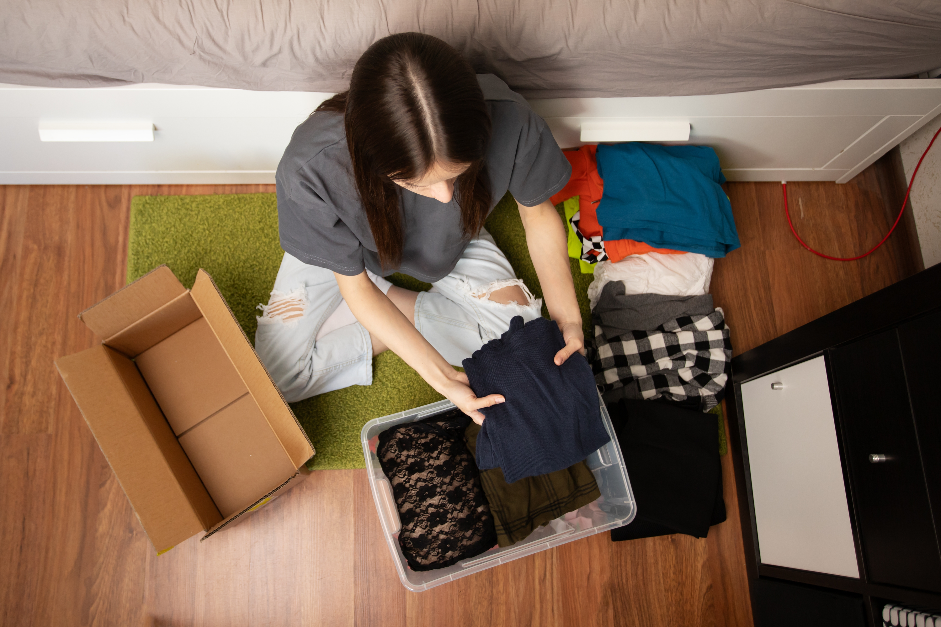 Woman unpacking box