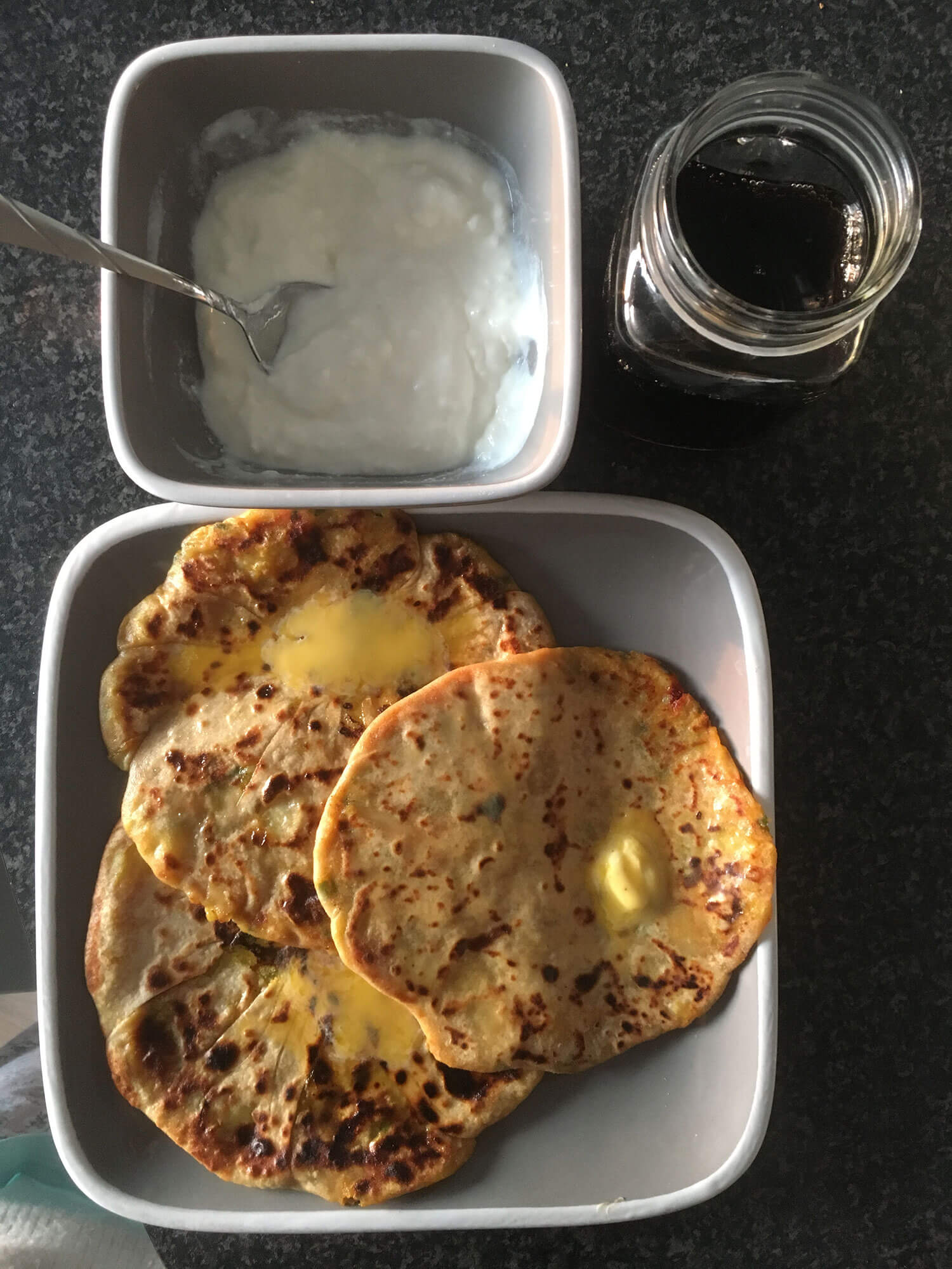 Aloo paratha with yoghurt and a drink