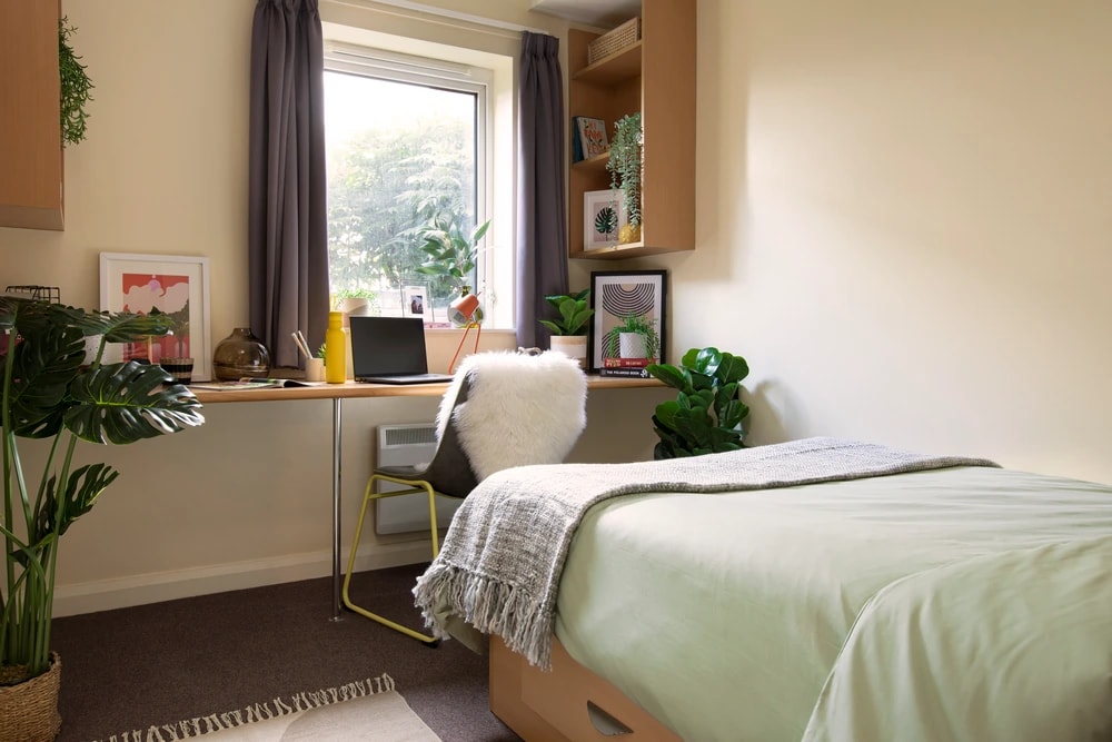 Bed and study space in an En-suite room